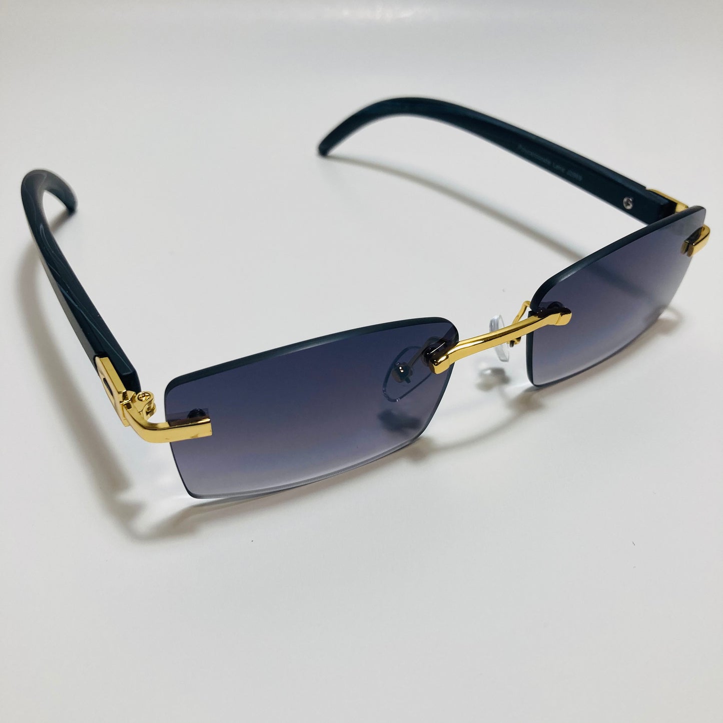 mens and womens black and gold rimless square sunglasses
