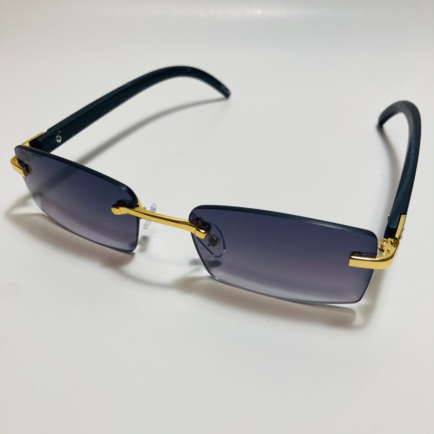 mens and womens black and gold rimless square sunglasses