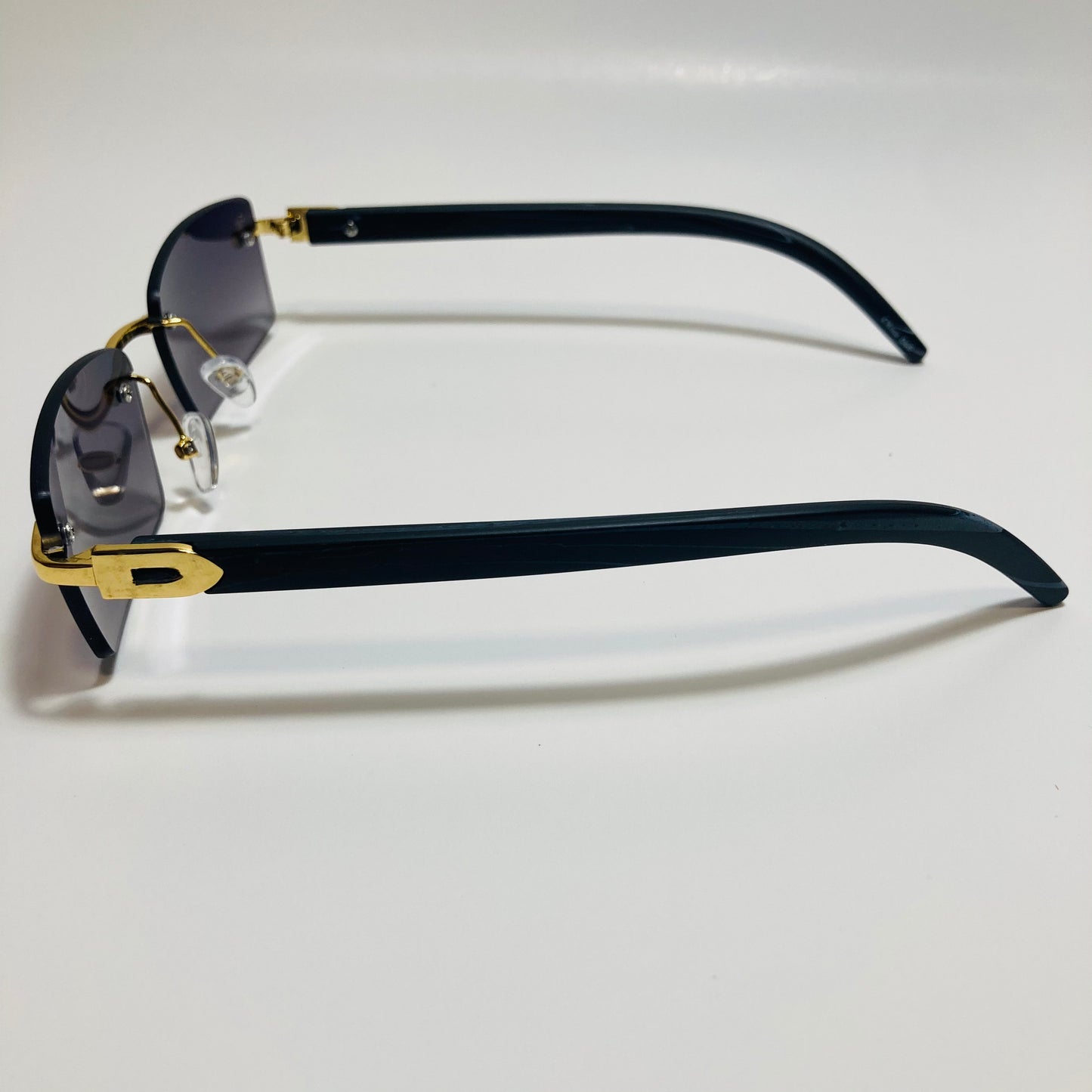 mens and womens black and gold rimless square sunglasses