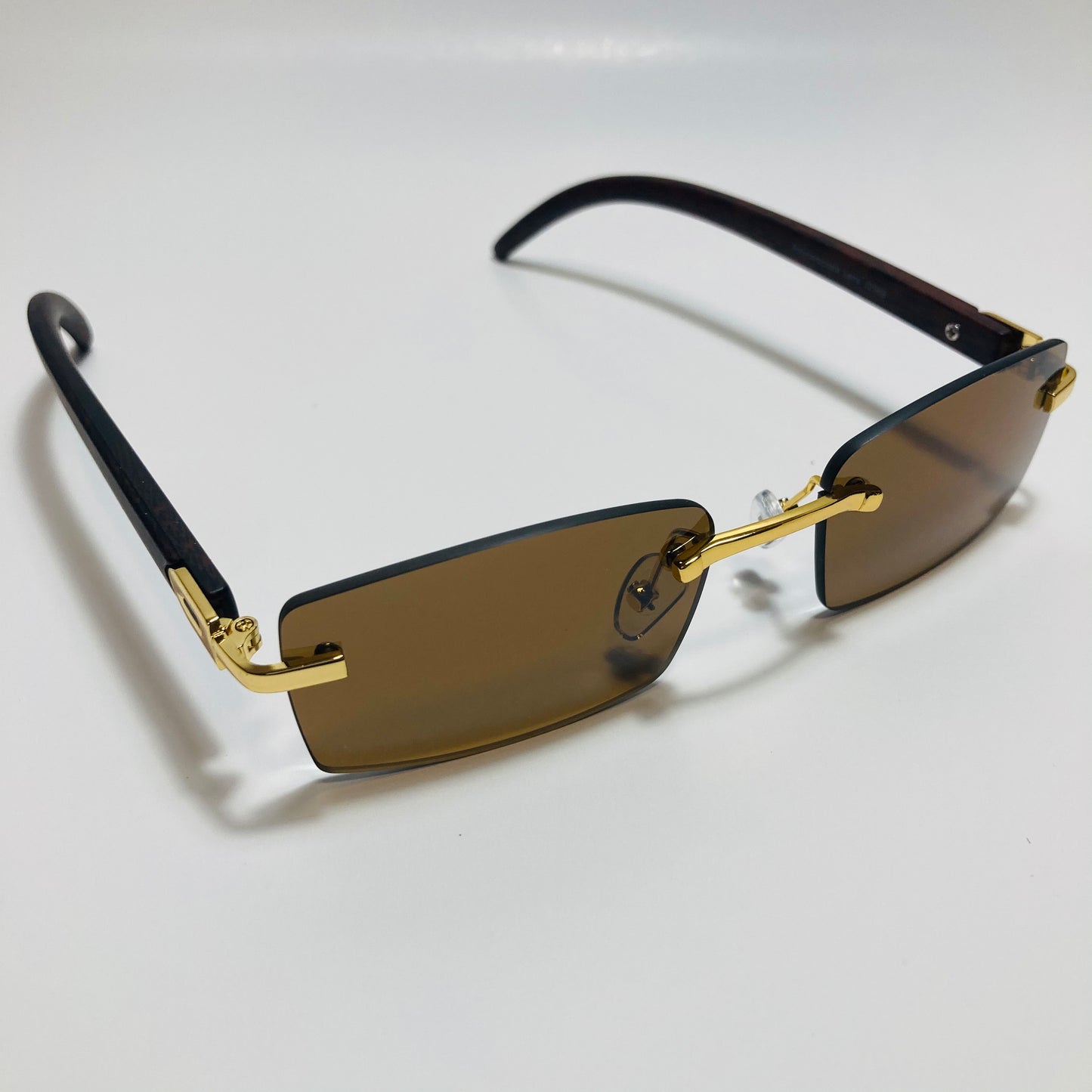 mens and womens brown and gold rimless square sunglasses