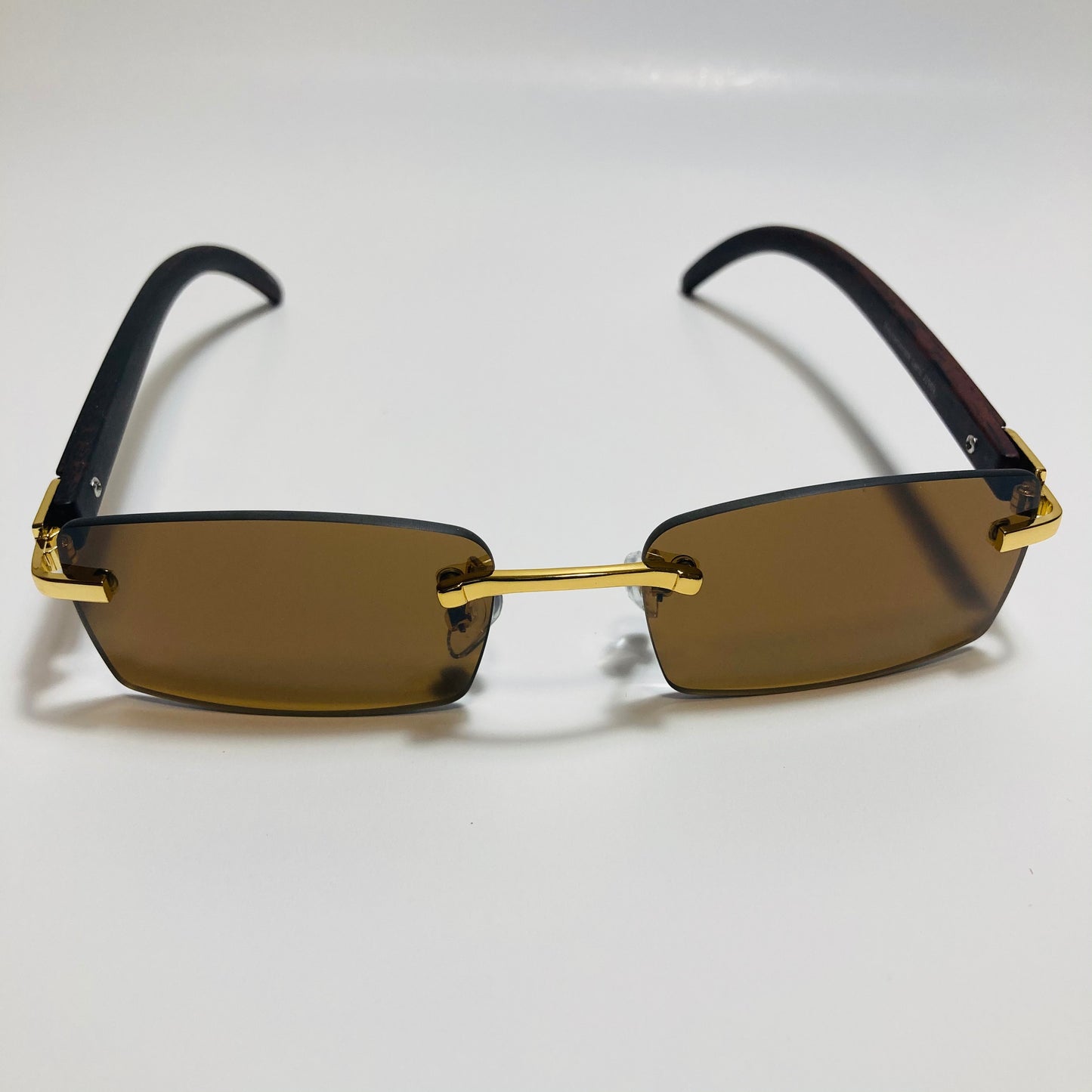 mens and womens brown and gold rimless square sunglasses