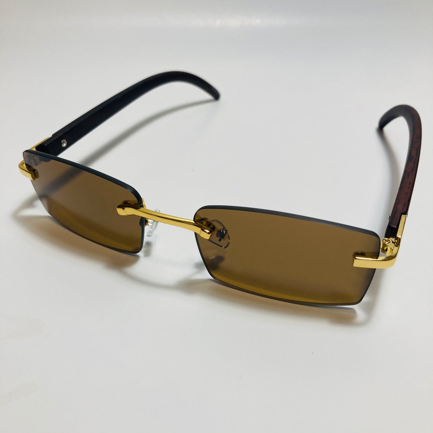 mens and womens brown and gold rimless square sunglasses