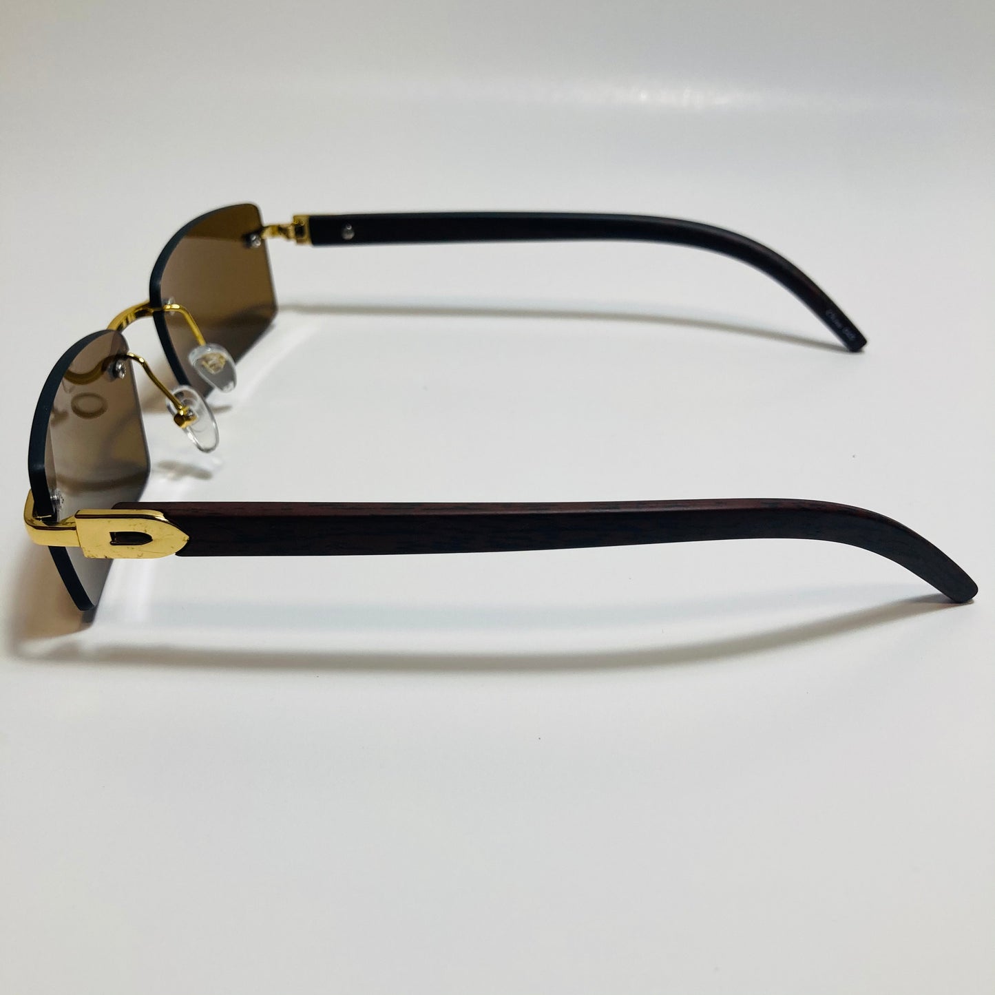 mens and womens brown and gold rimless square sunglasses