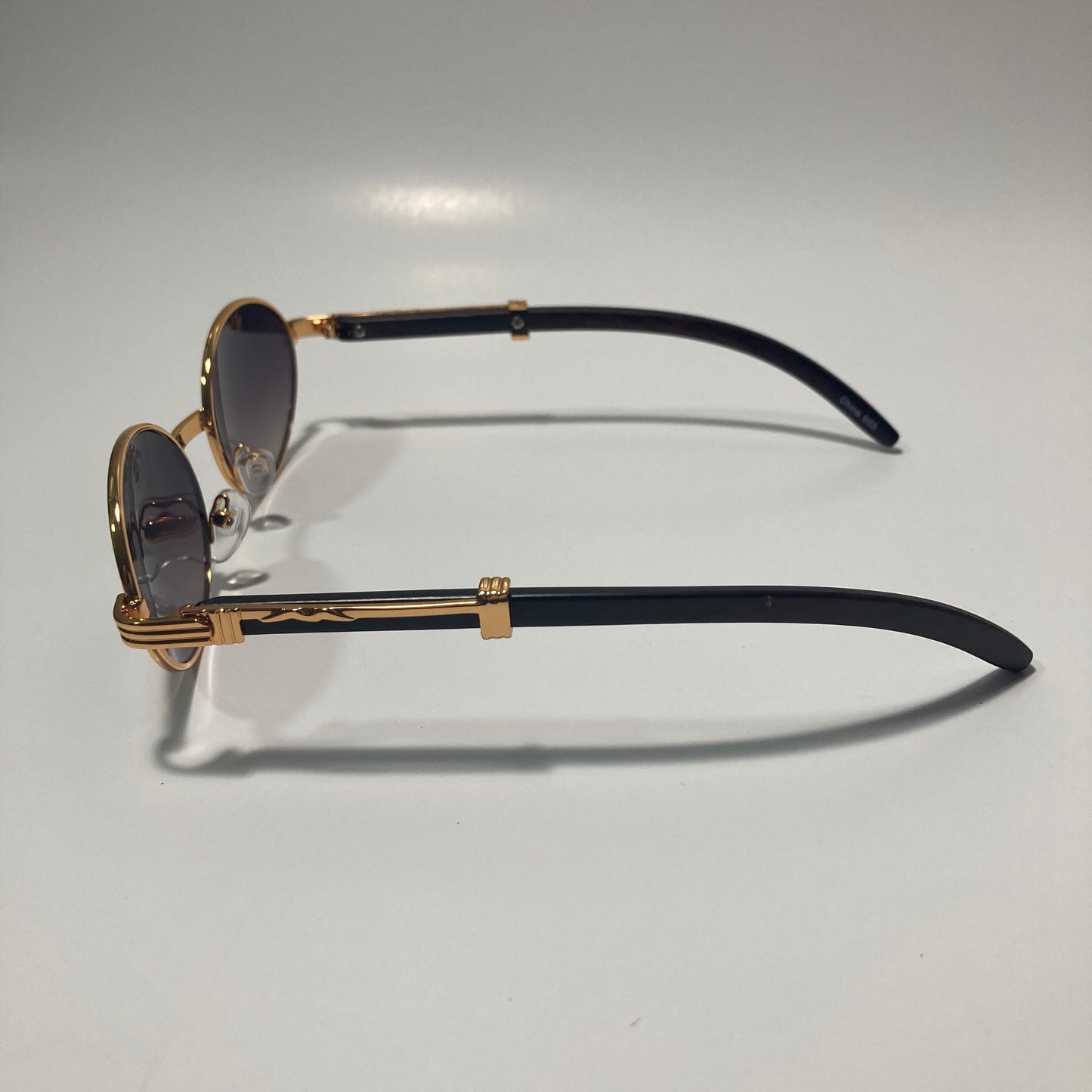mens and womens brown and gold round sunglasses