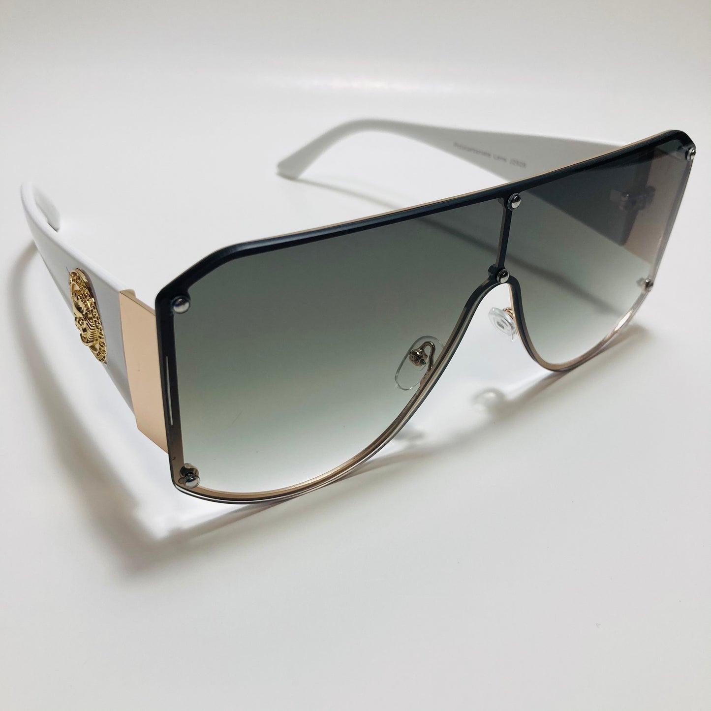 white green and gold shield sunglasses