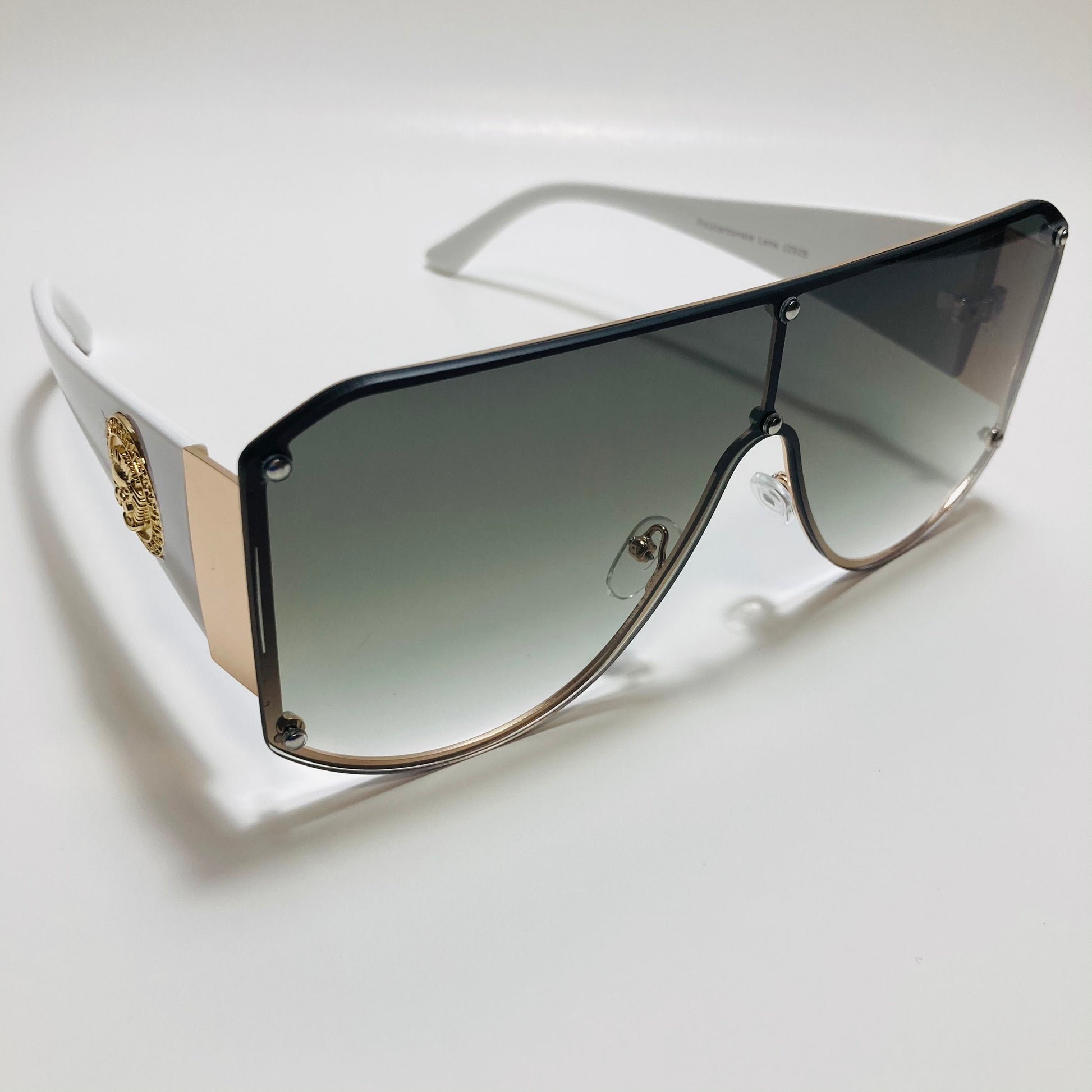 white green and gold shield sunglasses