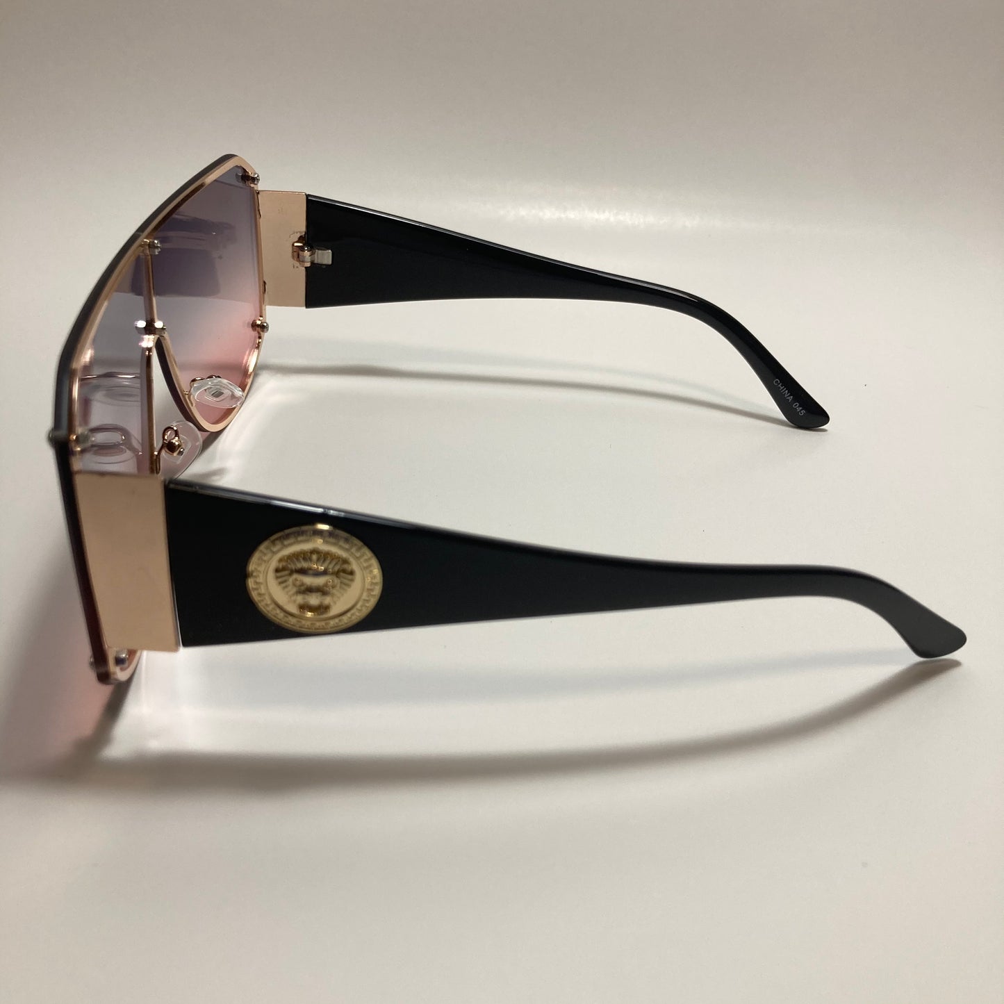 purple pink and gold shield sunglasses