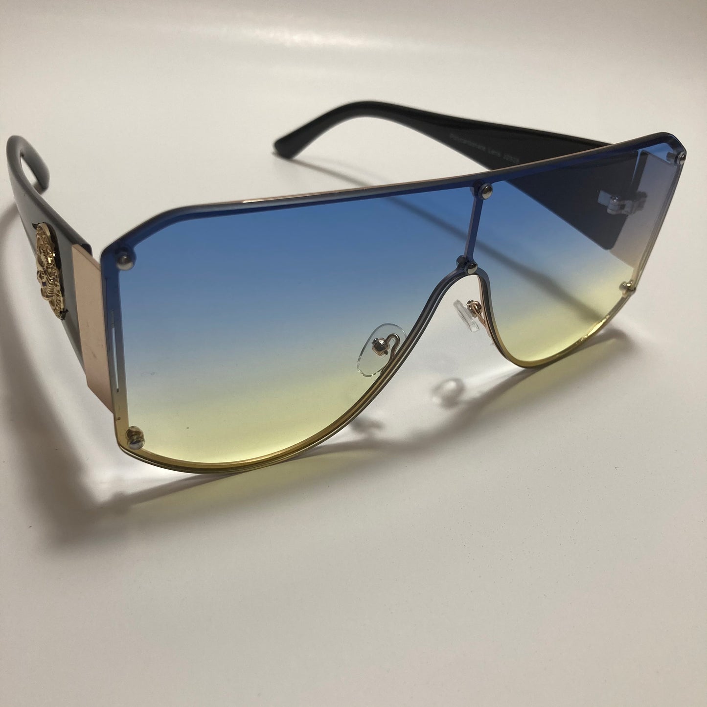 black yellow and blue shield sunglasses