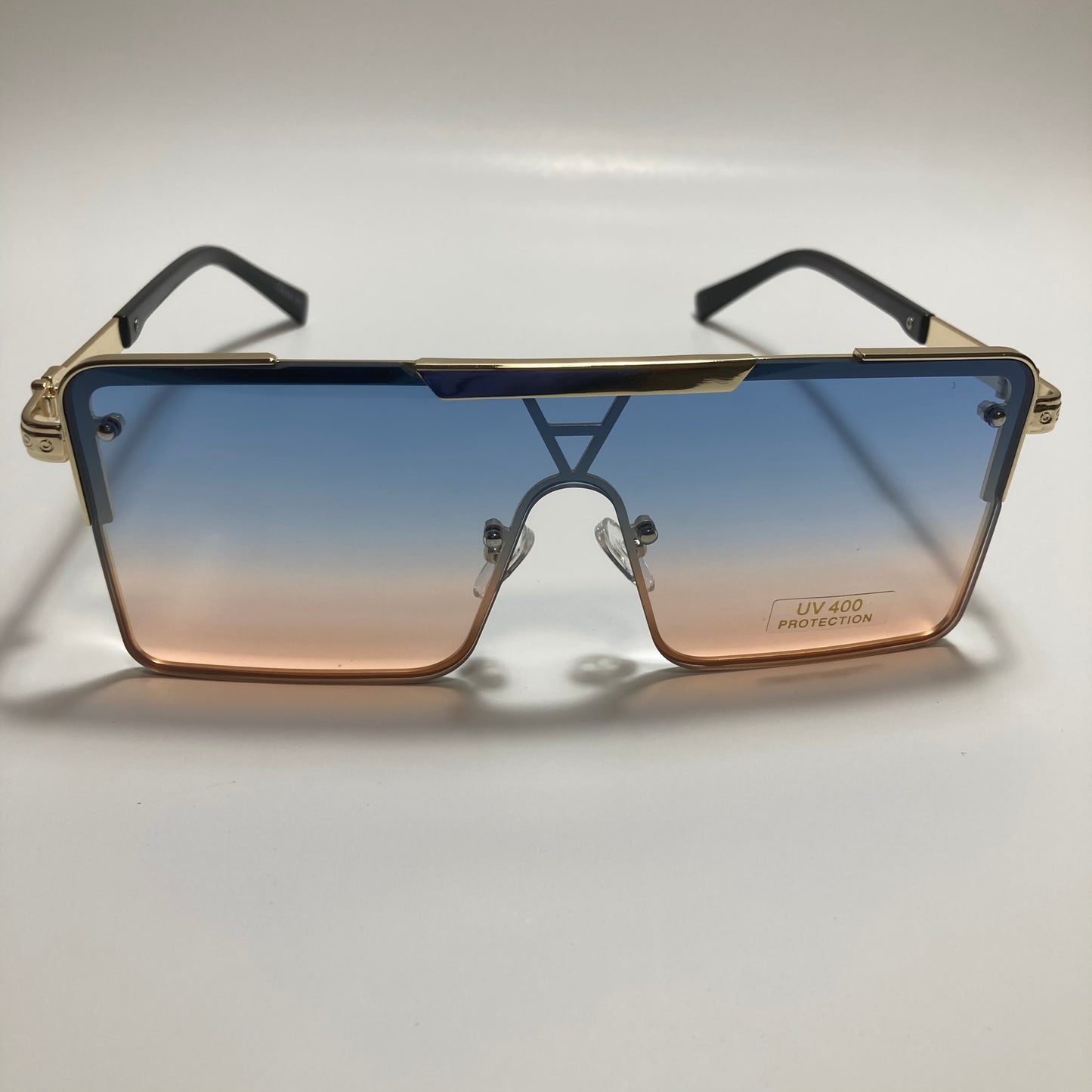 womens gold square oversize sunglasses with pink and blue lenses