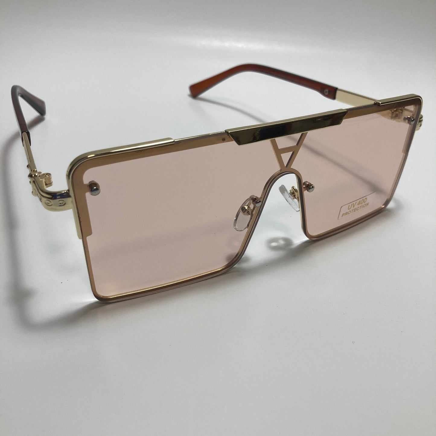 womens gold square oversize sunglasses with pink lenses
