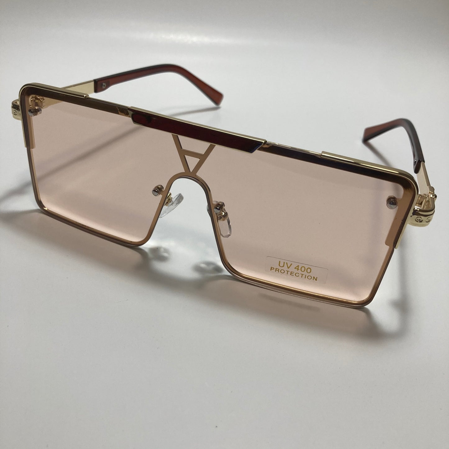 womens gold square oversize sunglasses with pink lenses