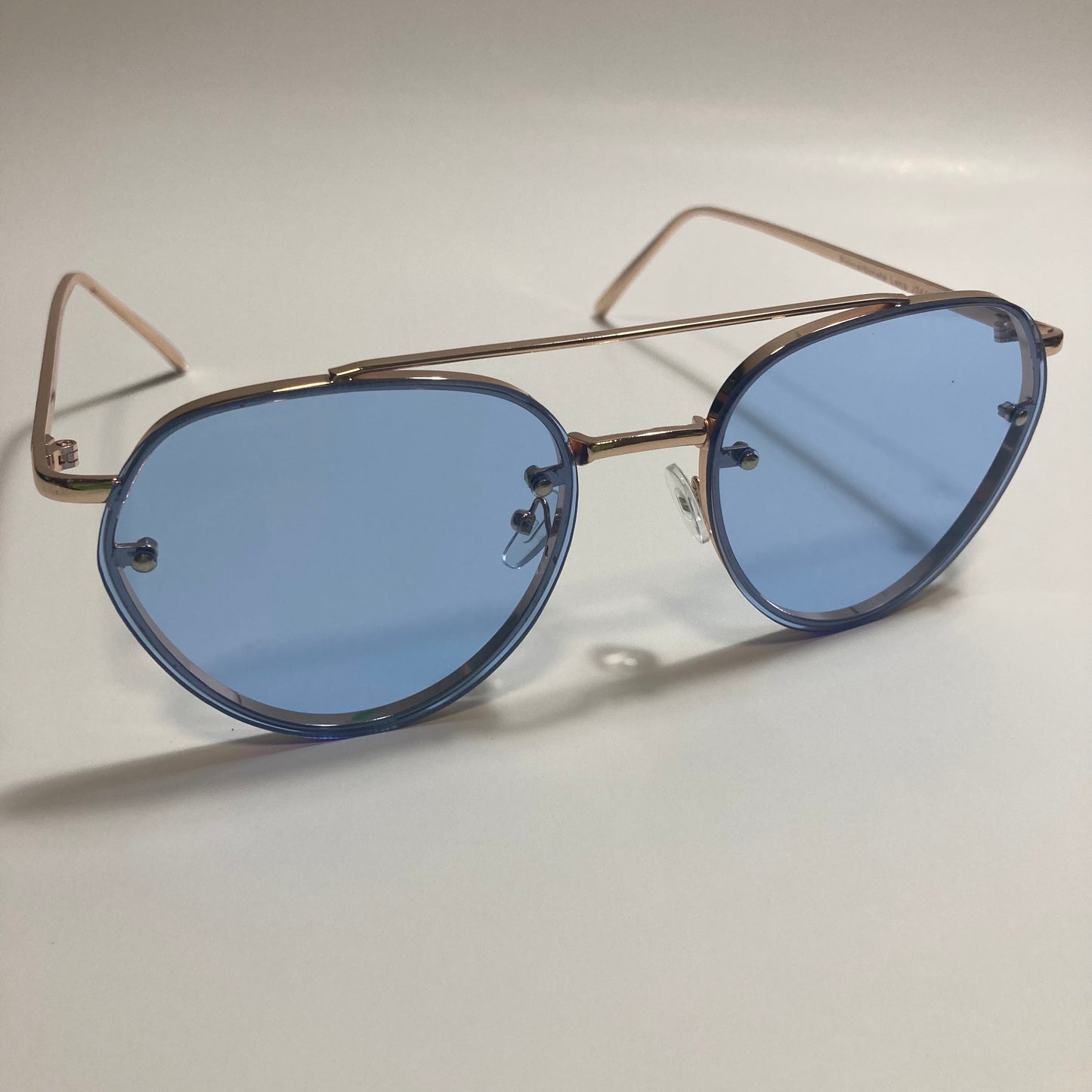 Womens and Mens gold Aviator sunglasses with blue lenses