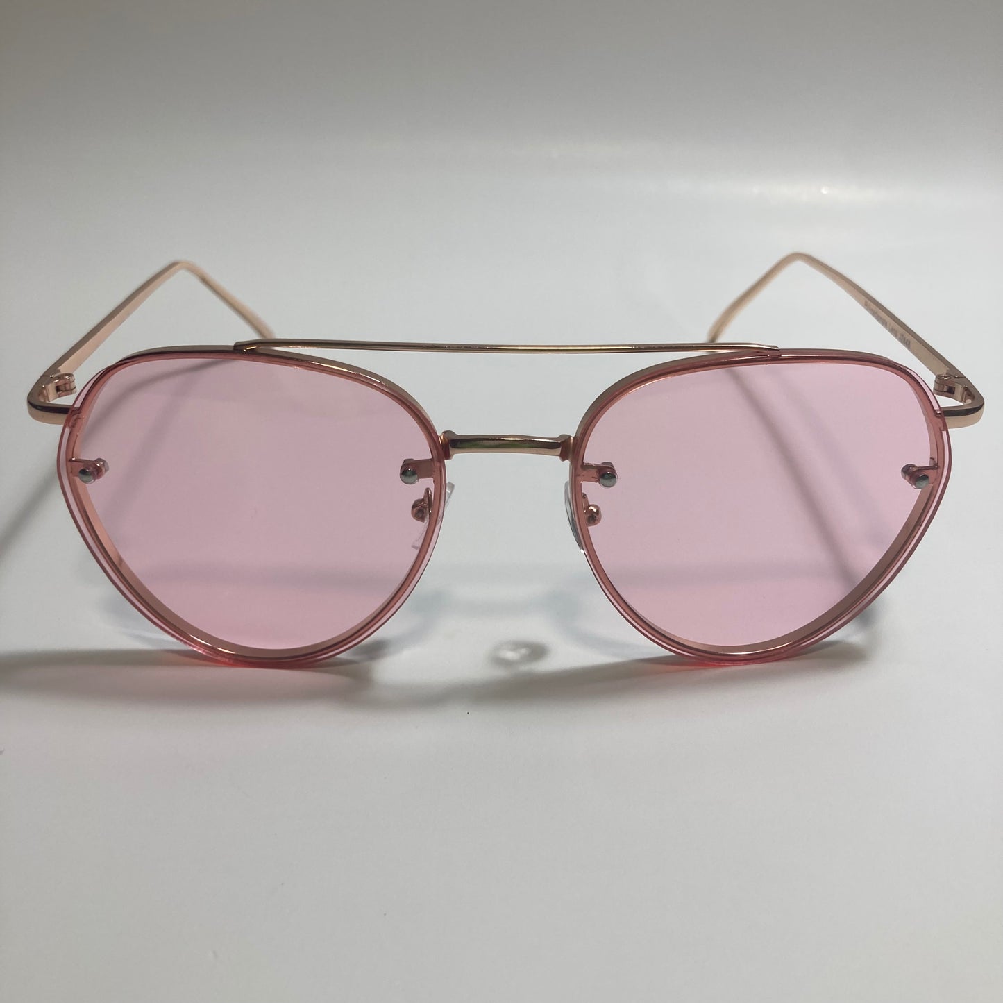 Womens and Mens gold Aviator sunglasses with pink lenses