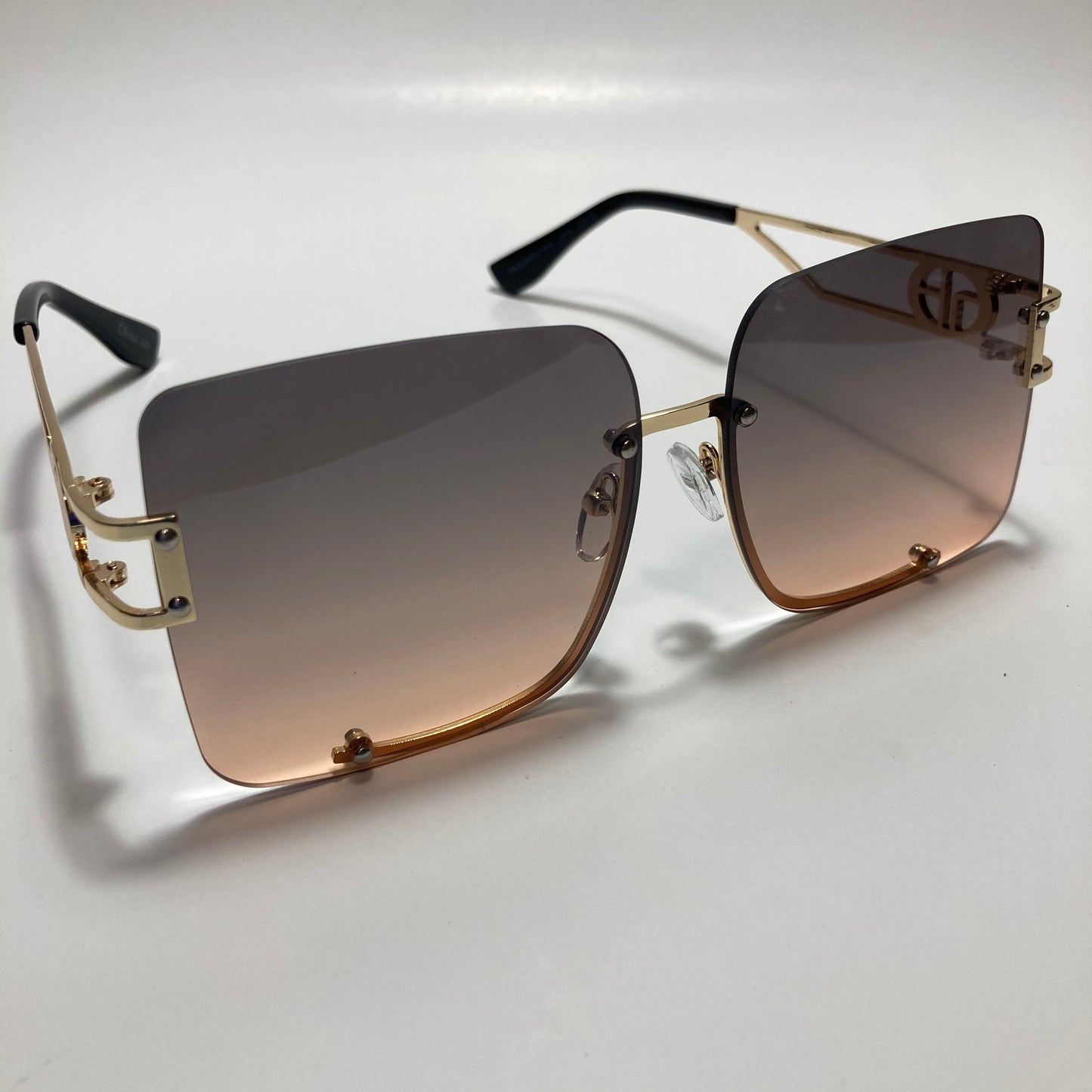 womens oversize square black and pink rimless sunglasses