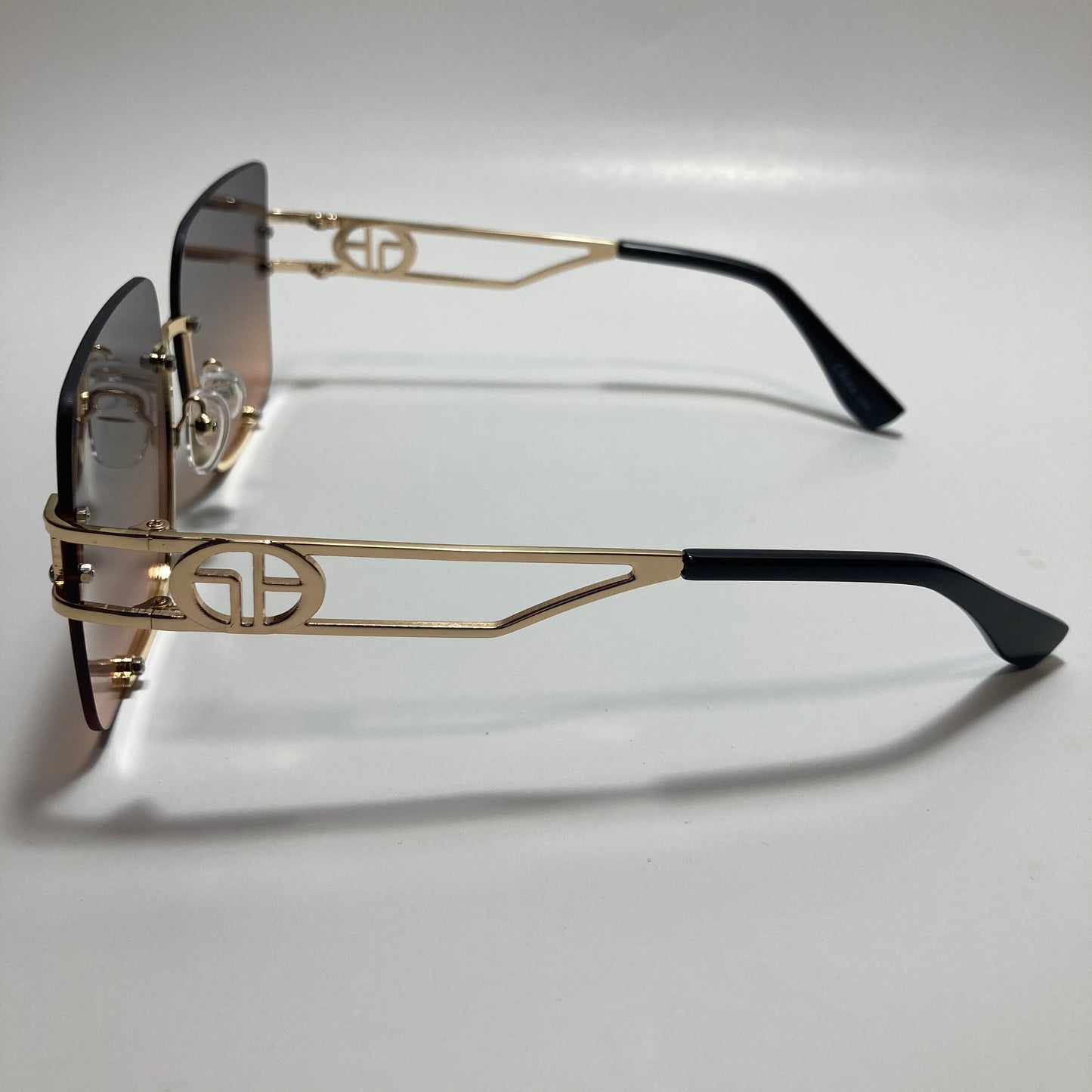 womens oversize square black and pink rimless sunglasses