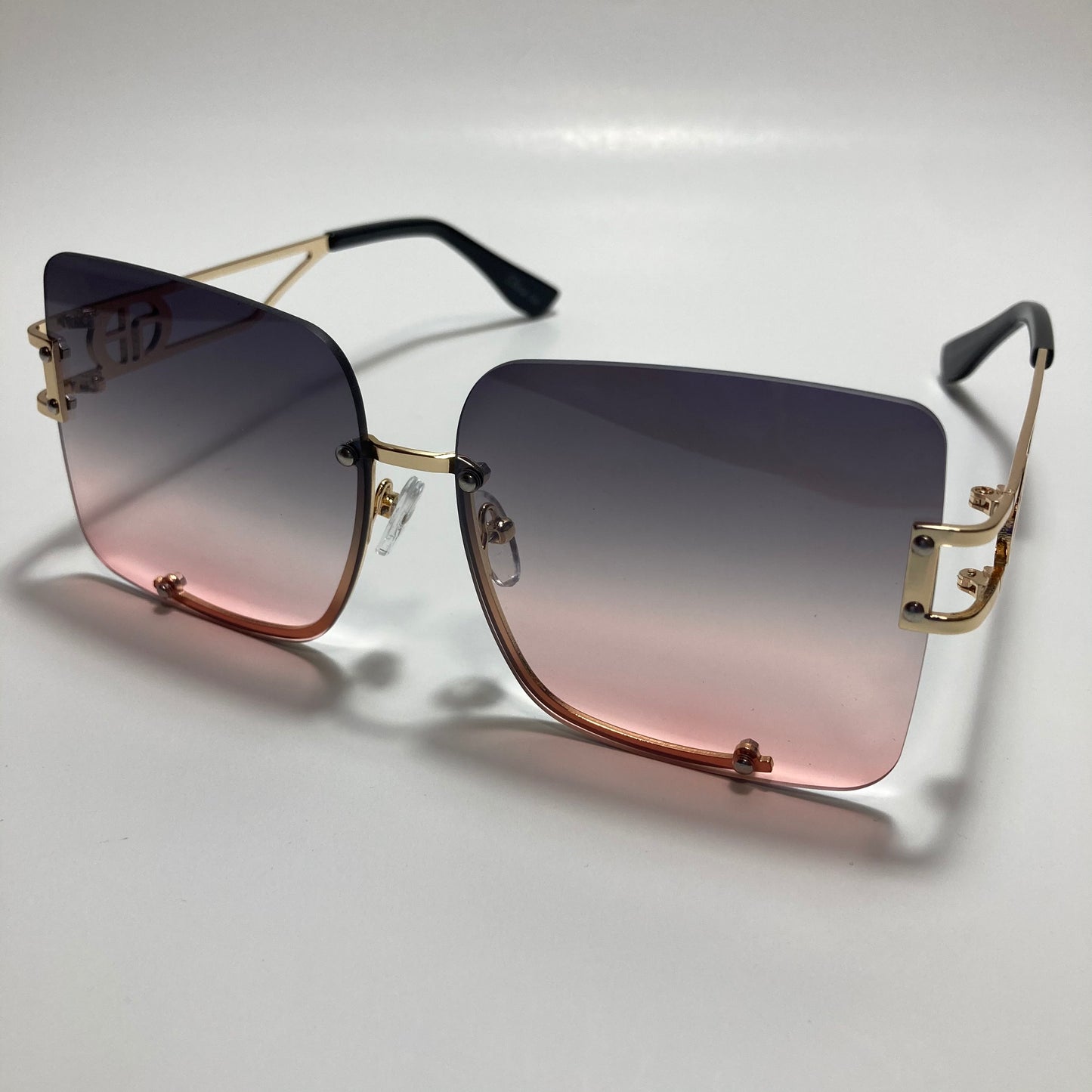 womens oversize square black and pink rimless sunglasses