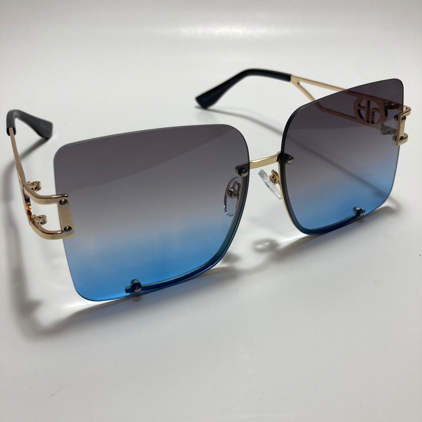 womens oversize square black and blue rimless sunglasses