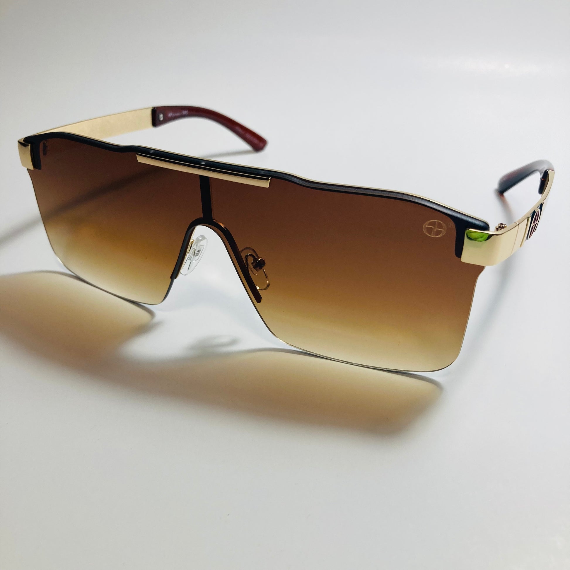 mens and womens brown and gold shield sunglasses