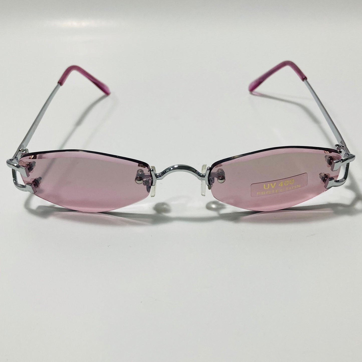 mens and womens silver and purple small rimless sunglasses