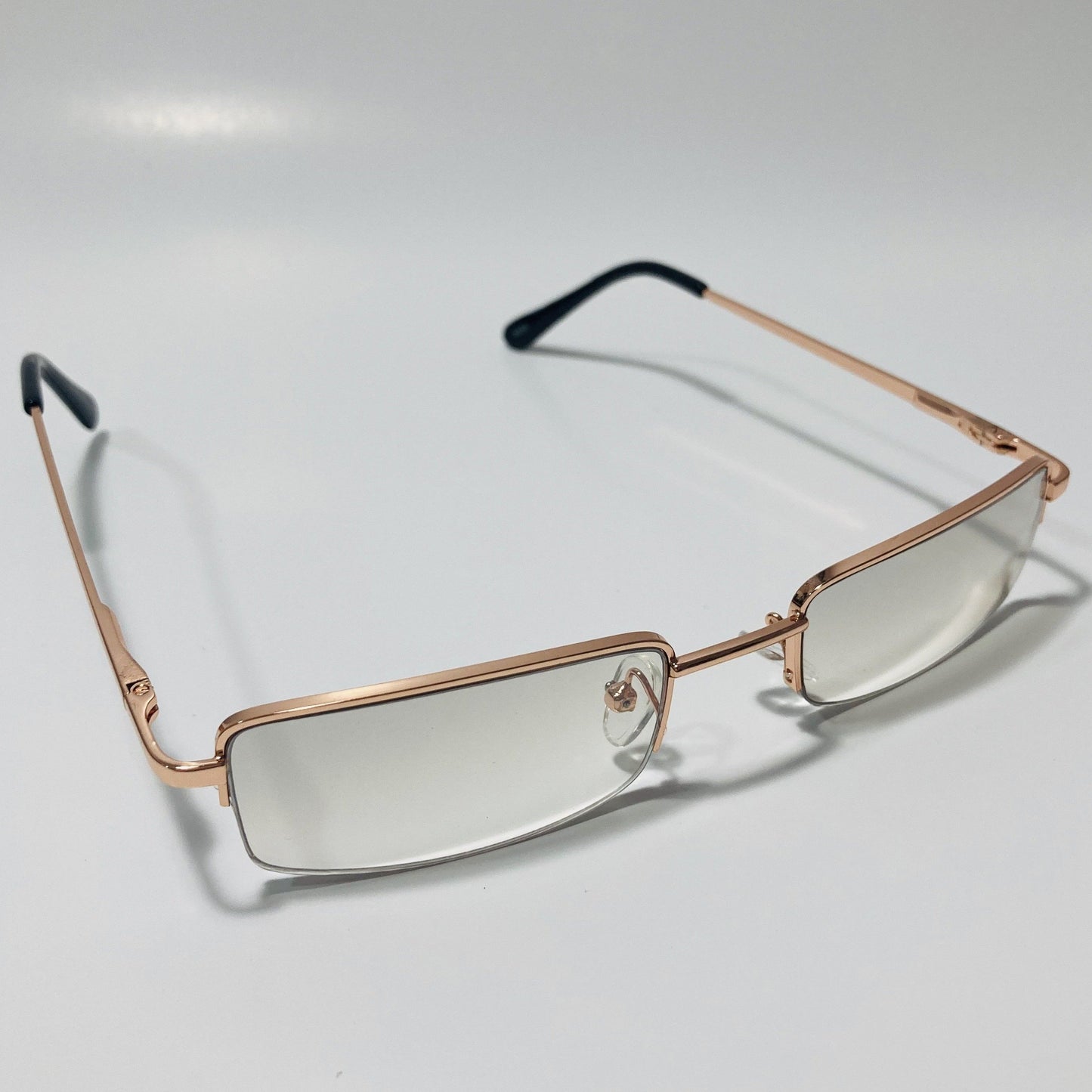 womens and mens clear and gold metal square sunglasses