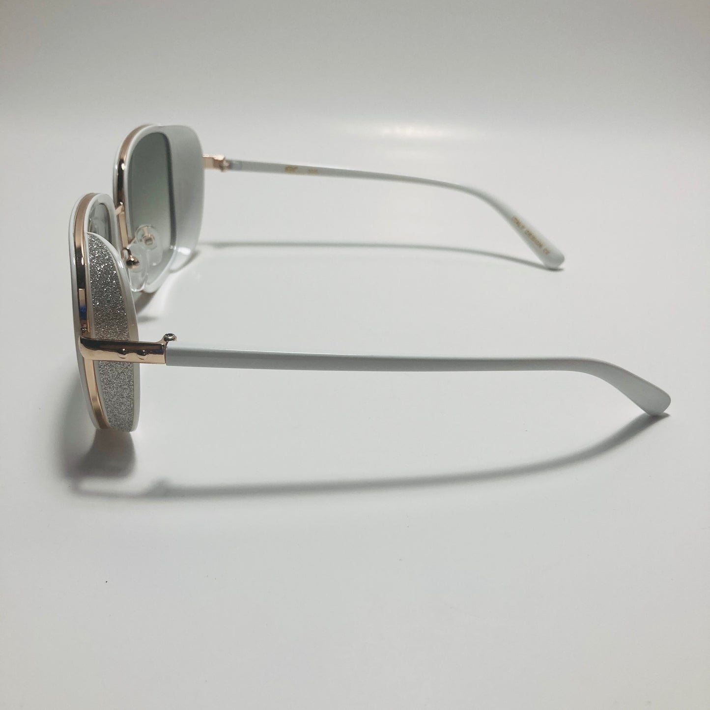 white and green elton john sunglasses
