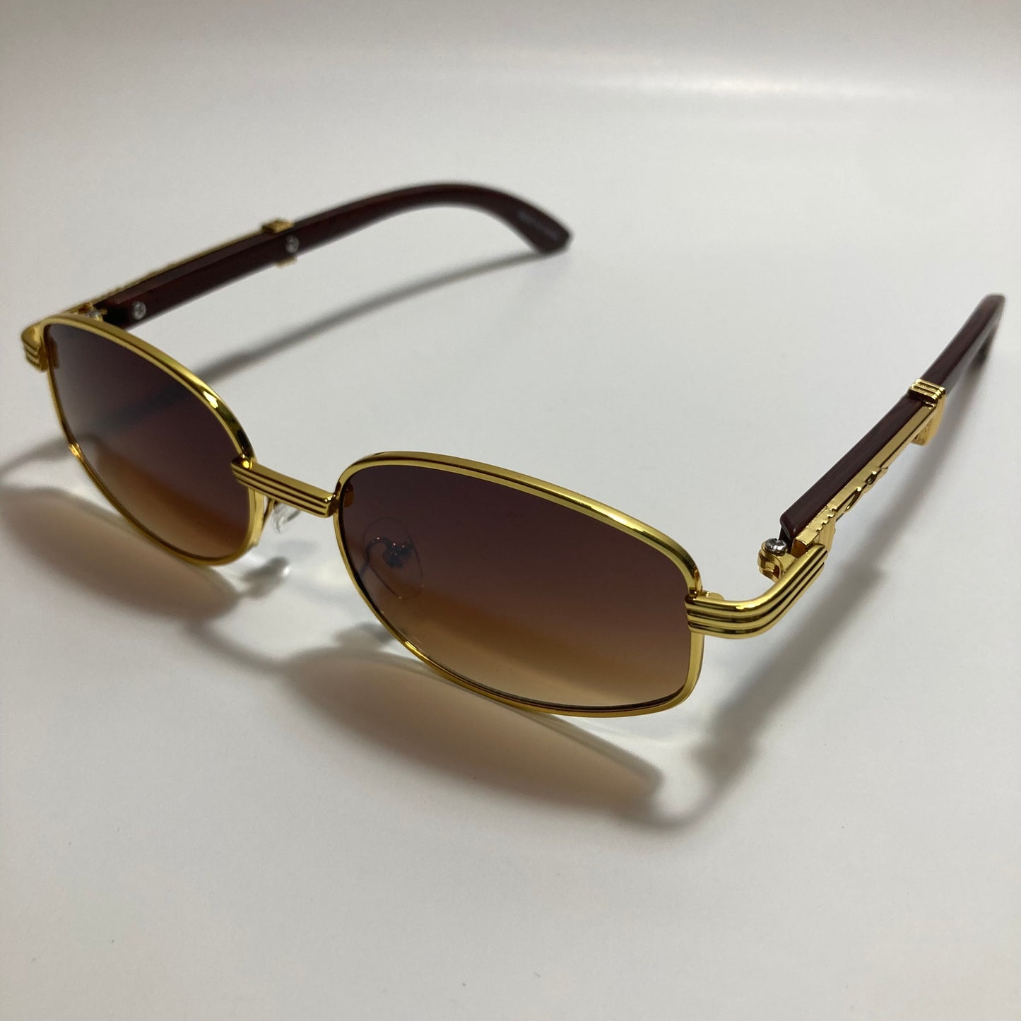 mens and womens brown and gold oval sunglasses