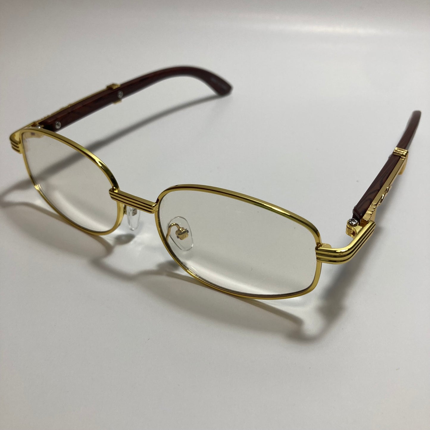 mens and womens clear and gold oval sunglasses