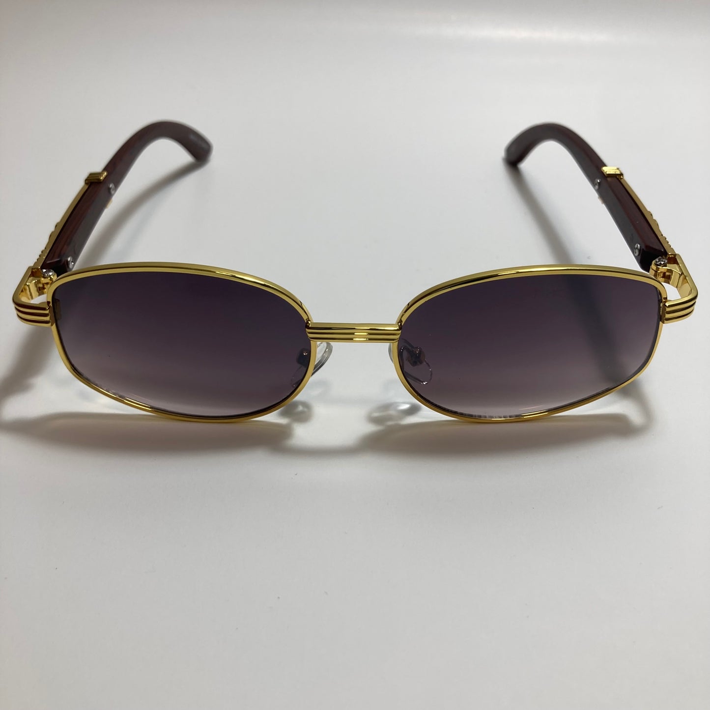 mens and womens black and gold oval sunglasses