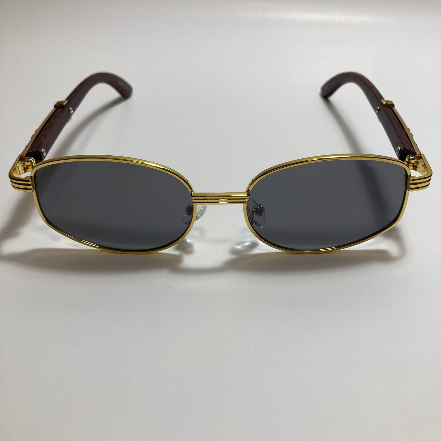 mens and womens black and gold oval sunglasses