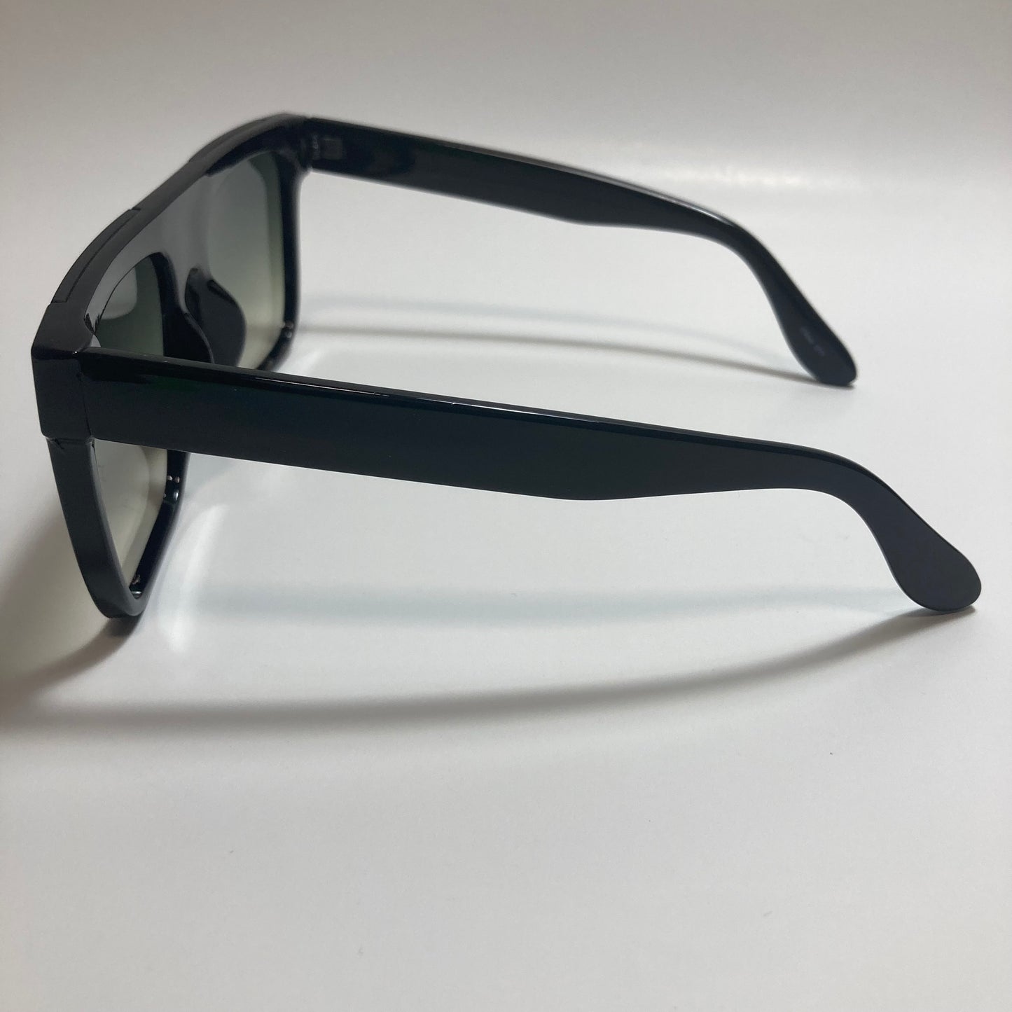 womens black oversize square sunglasses with green lenses