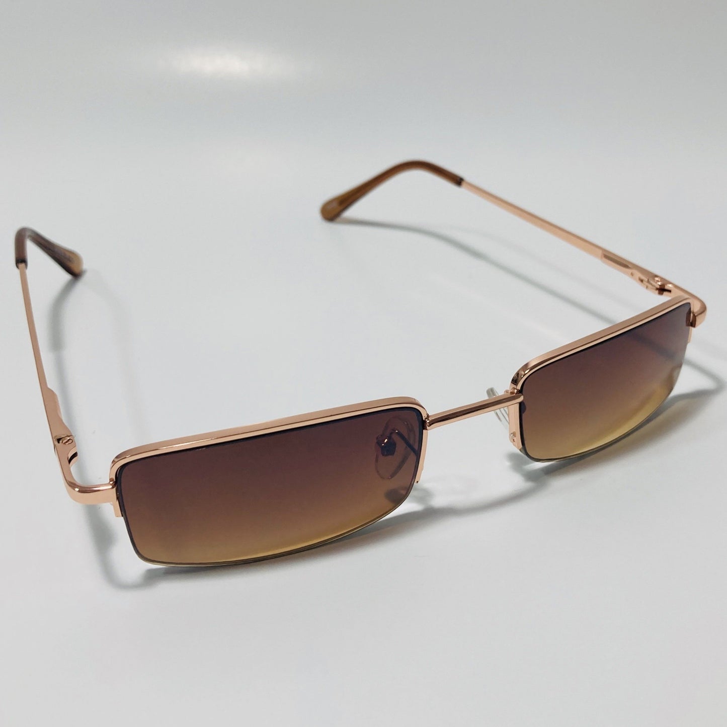 womens and mens brown and gold metal square sunglasses