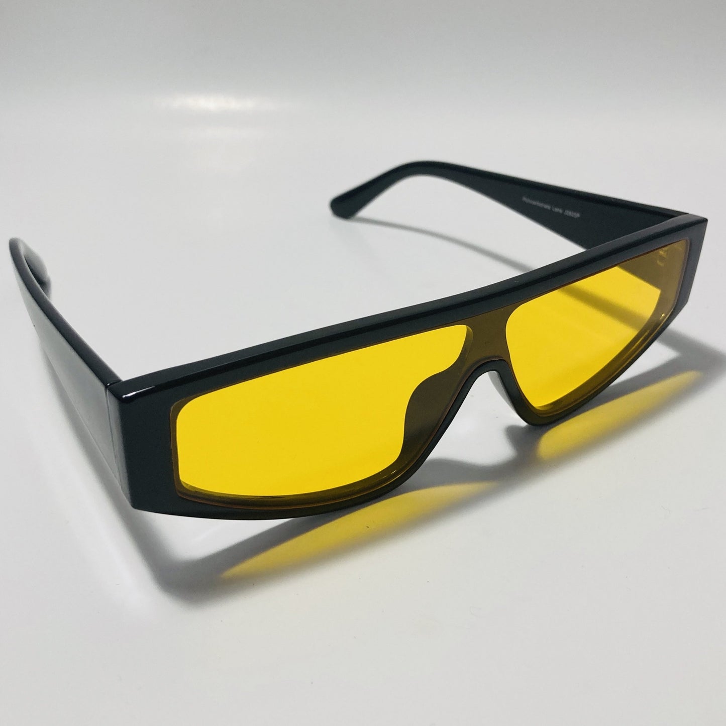 mens and womens black futuristic sunglasses with yellow lenses