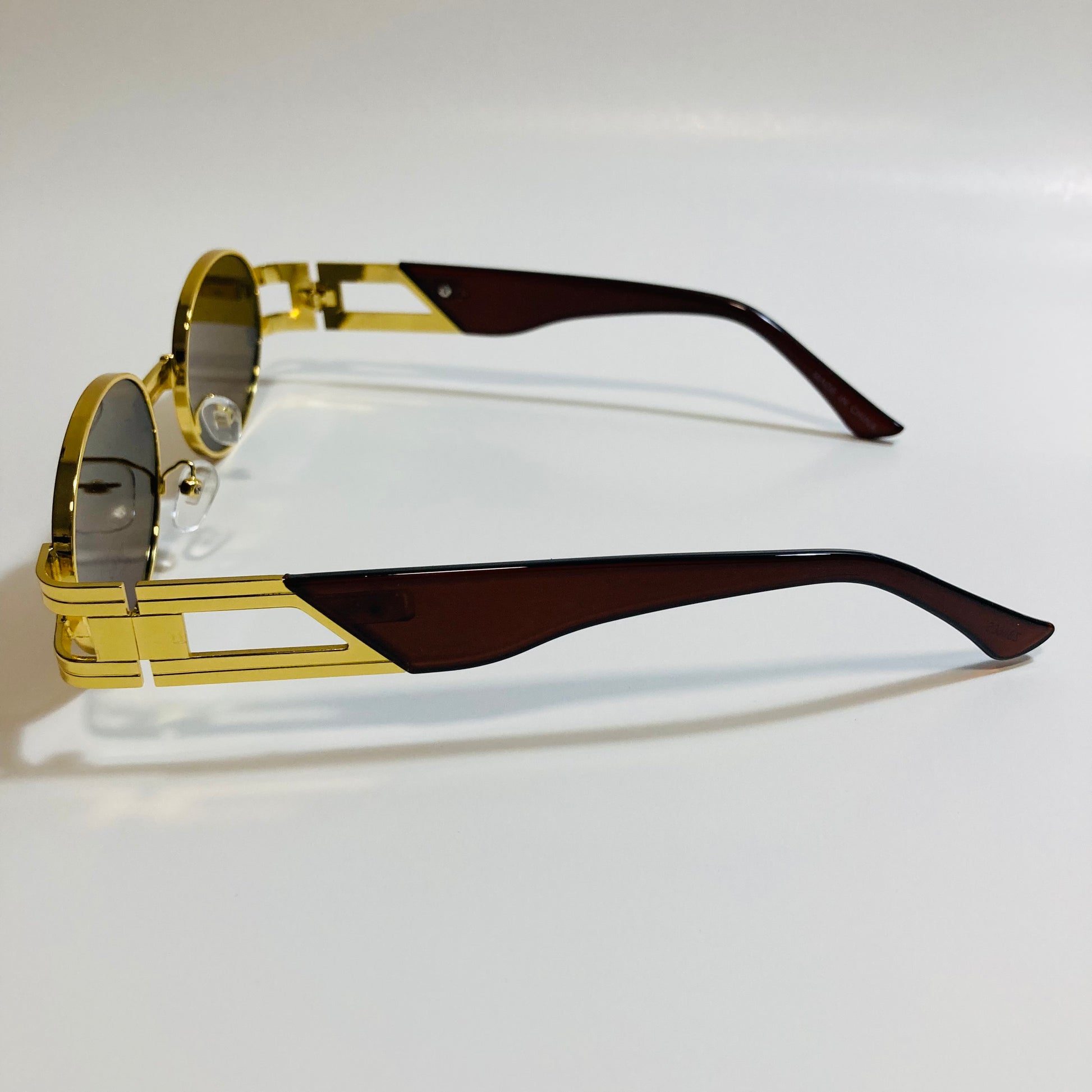 mens and womens gold and brown round sunglasses