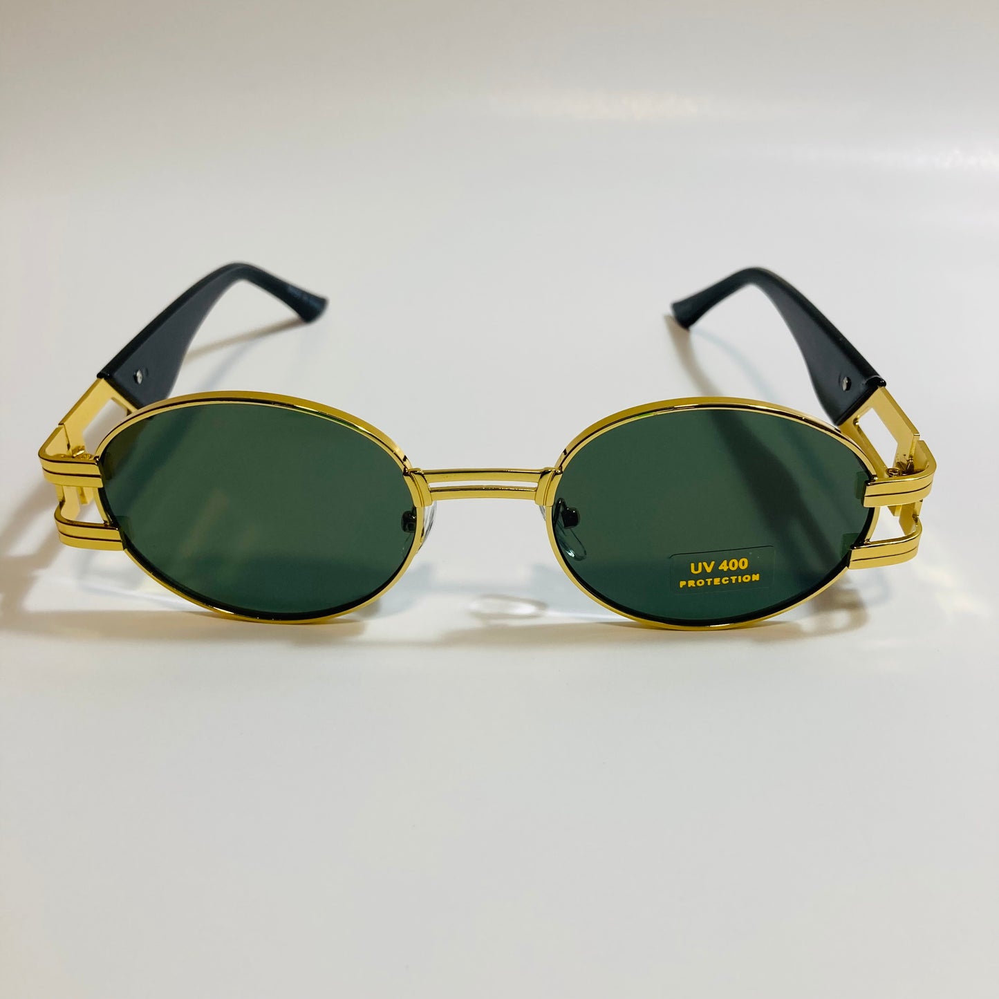 mens and womens green and gold round sunglasses