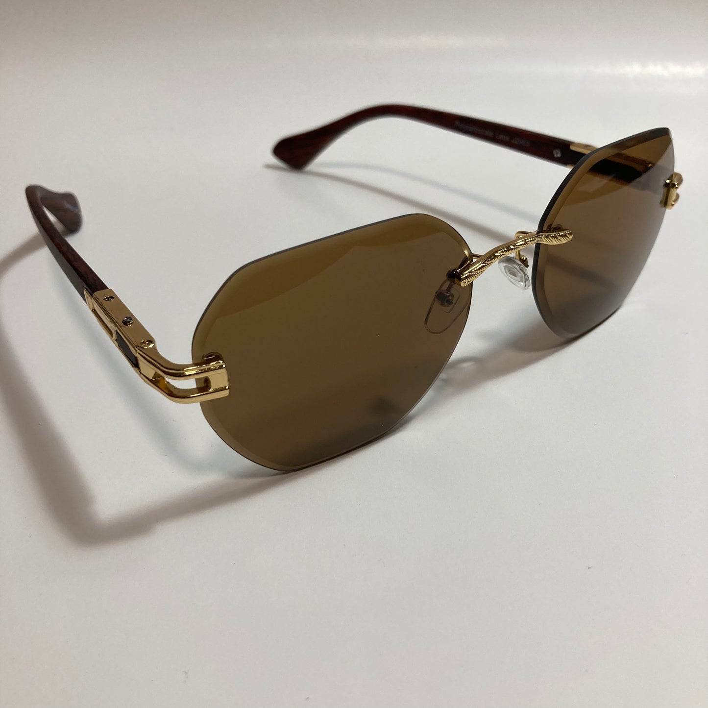 brown and gold rimless sunglasses