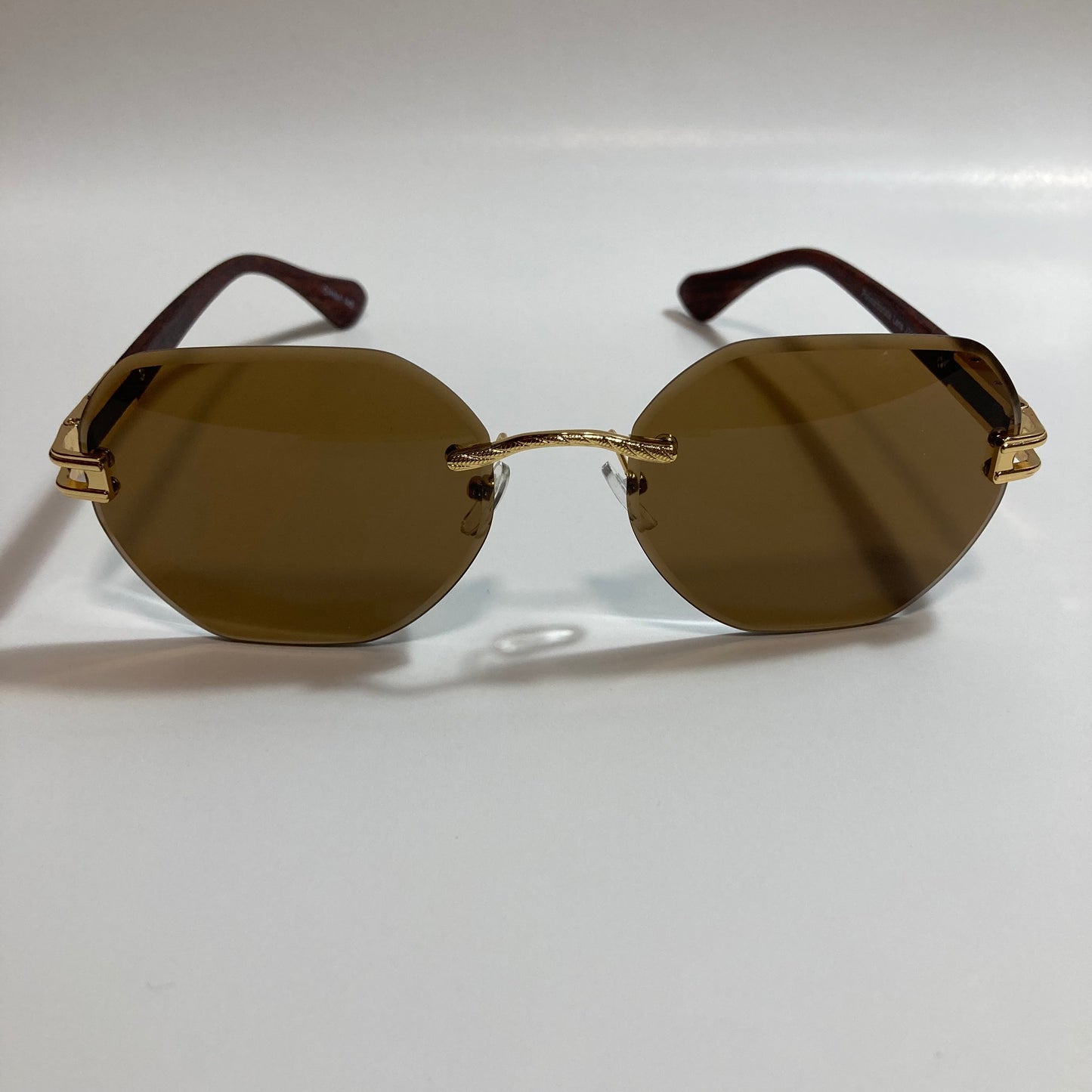 brown and gold rimless sunglasses