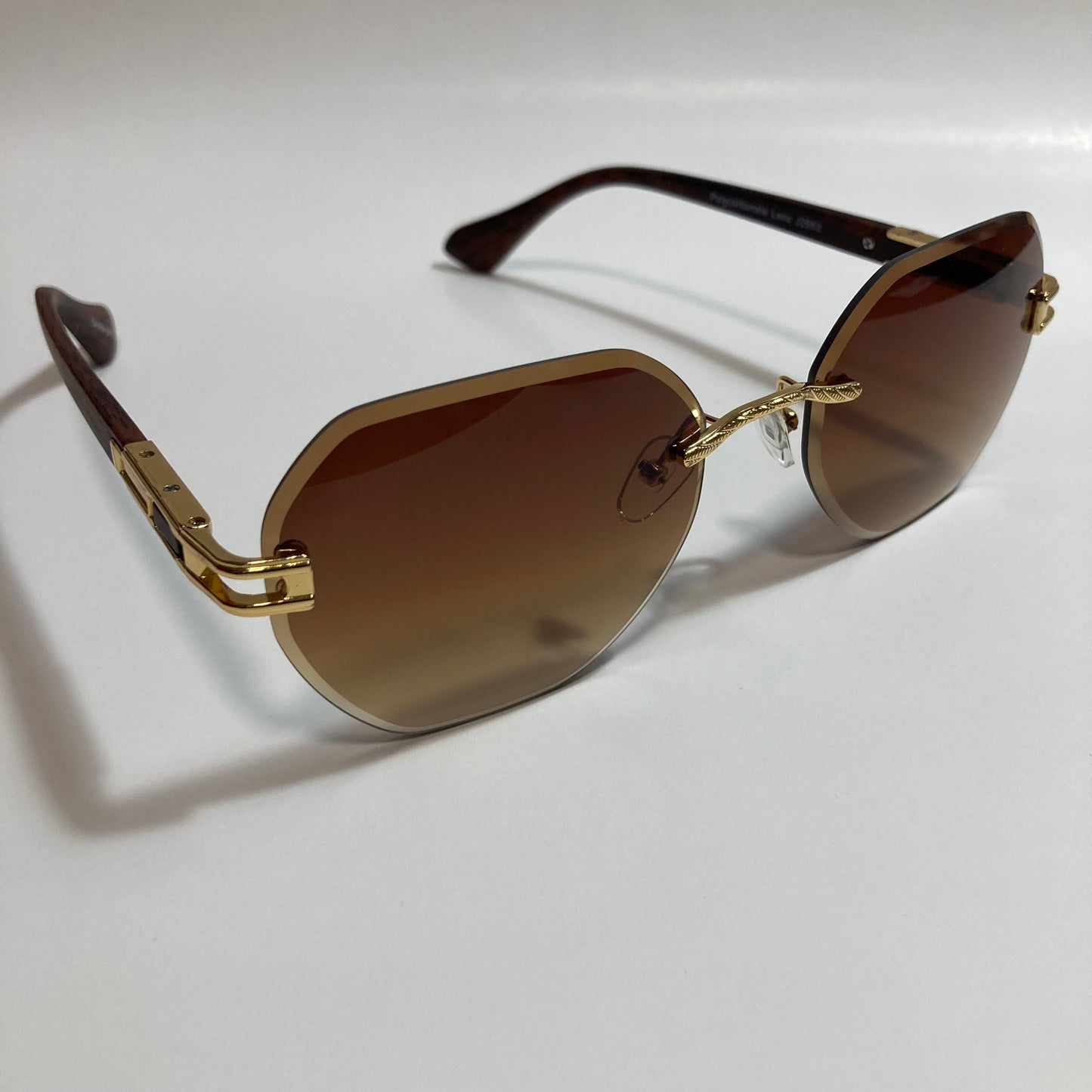 brown and gold rimless sunglasses