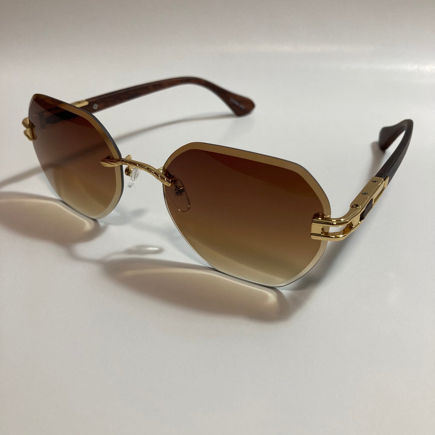 brown and gold rimless sunglasses