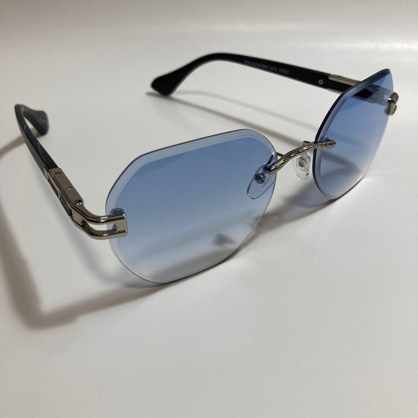 blue and silver rimless sunglasses