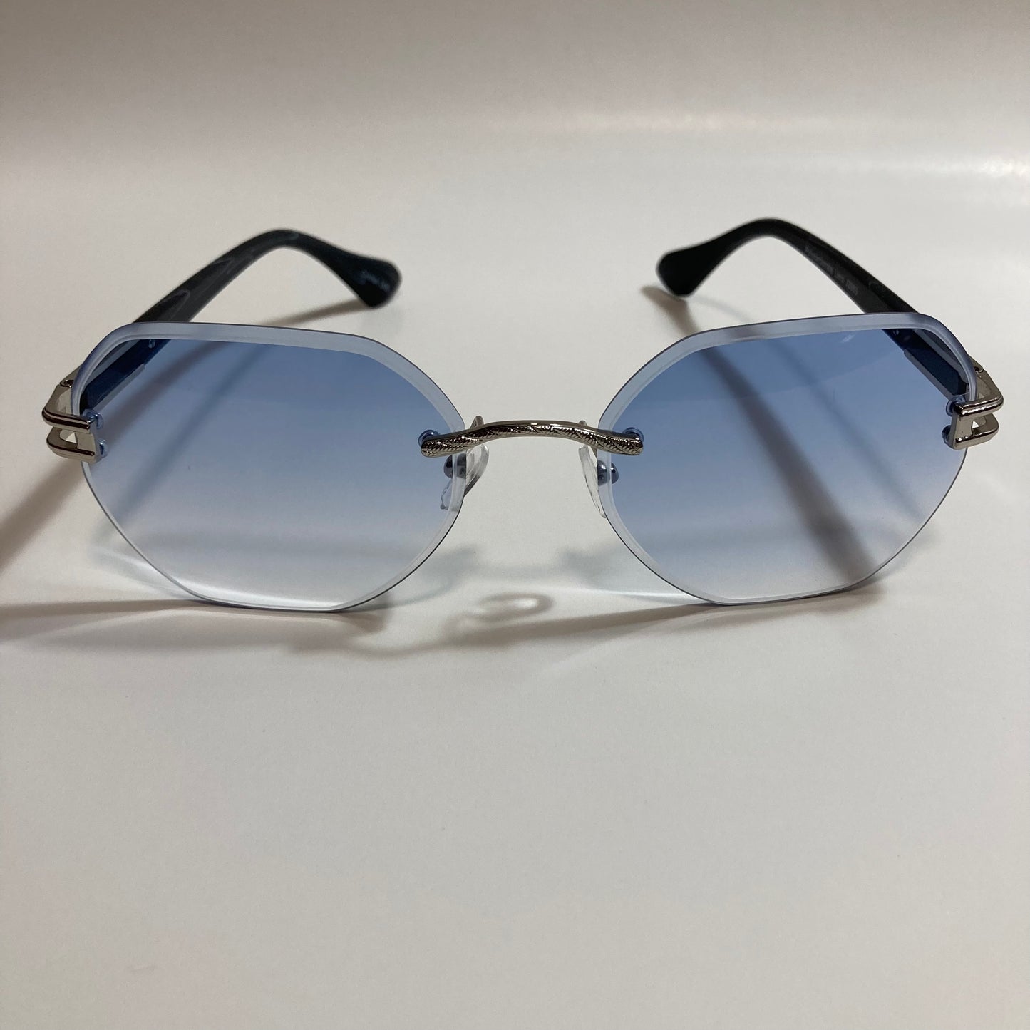 blue and silver rimless sunglasses