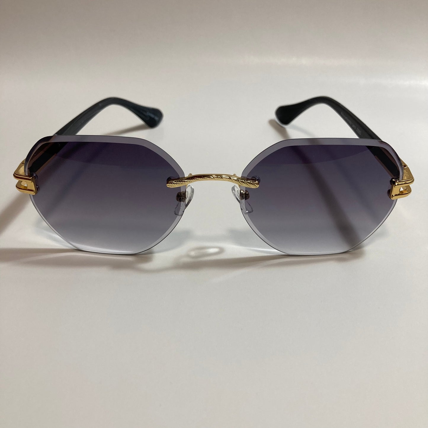 black and gold rimless sunglasses