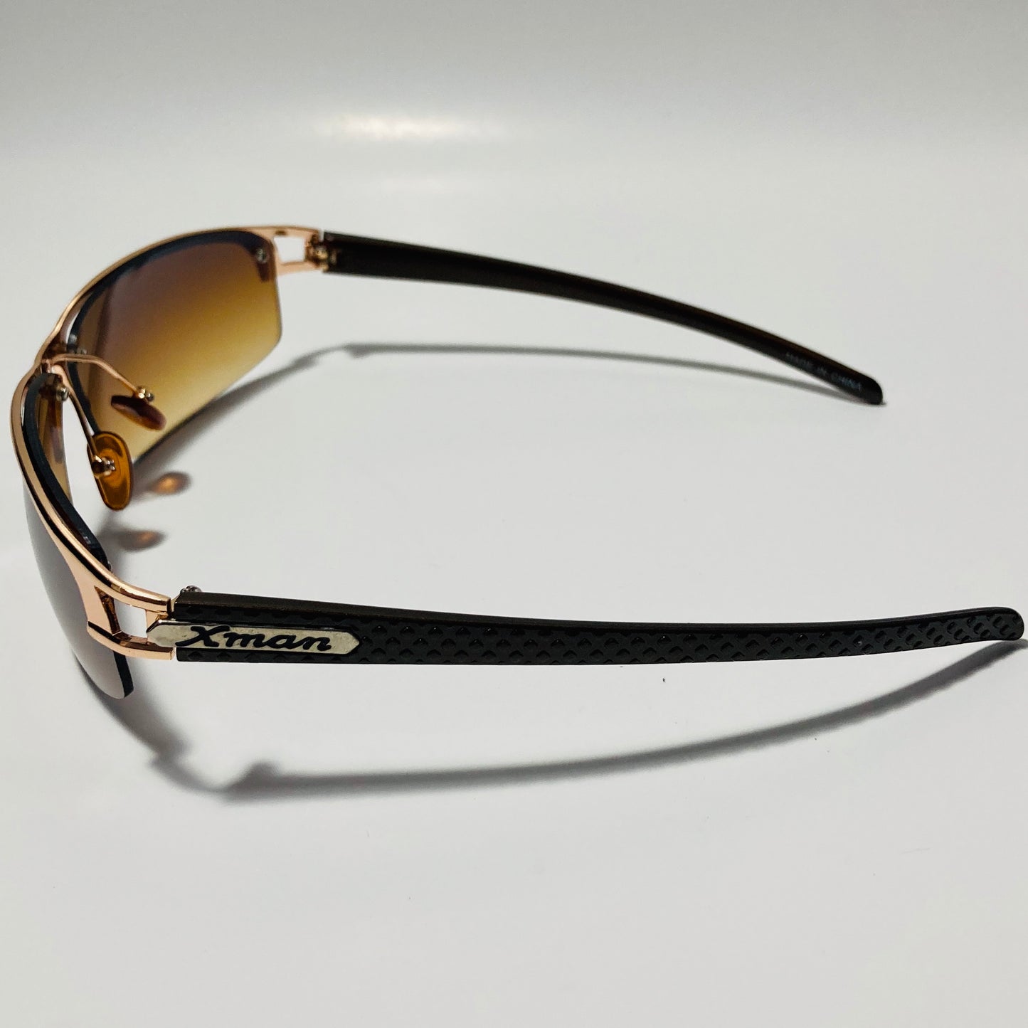 womens and mens gold wrap around sunglasses with brown lenses