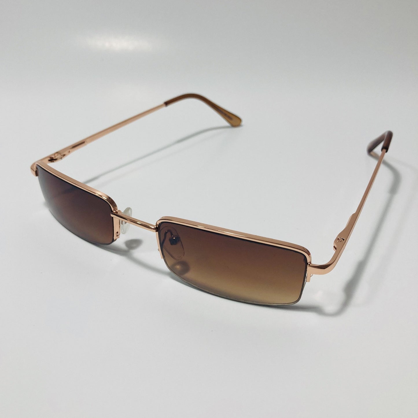 womens and mens brown and gold metal square sunglasses