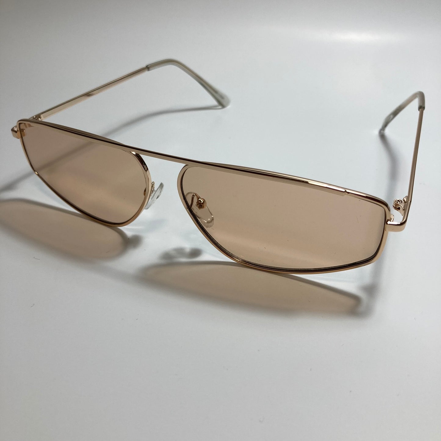 mens and womens brown and gold futuristic sunglasses