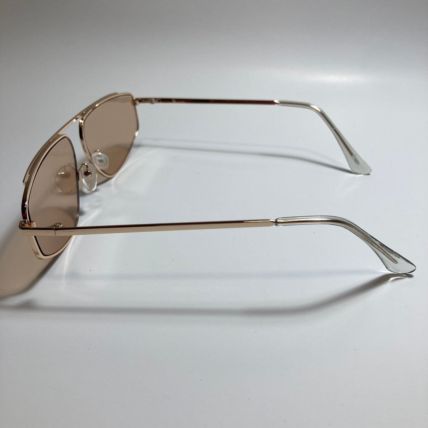 mens and womens brown and gold futuristic sunglasses