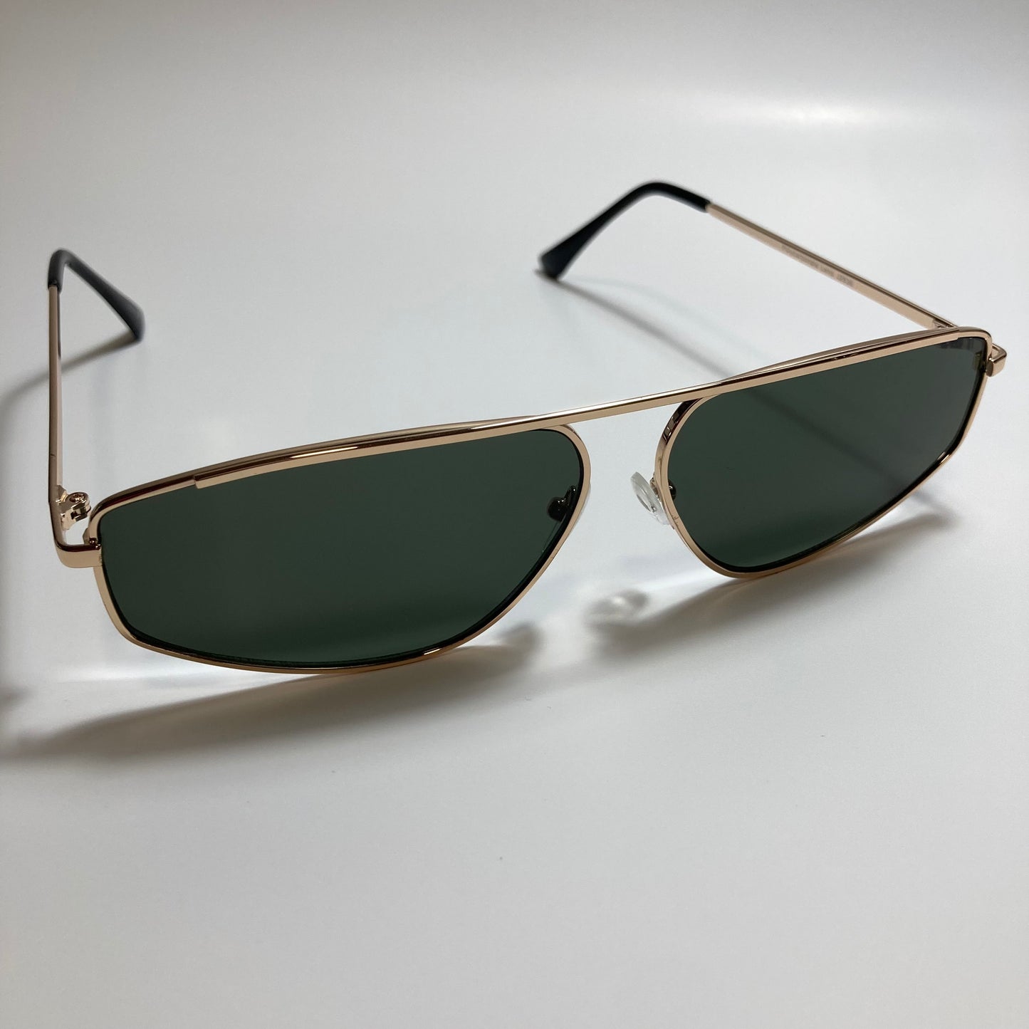 mens and womens green and gold futuristic sunglasses