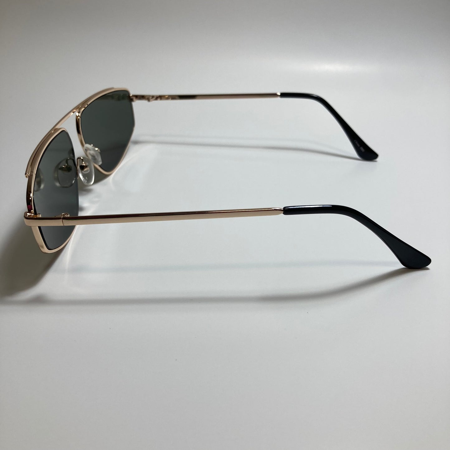 mens and womens green and gold futuristic sunglasses