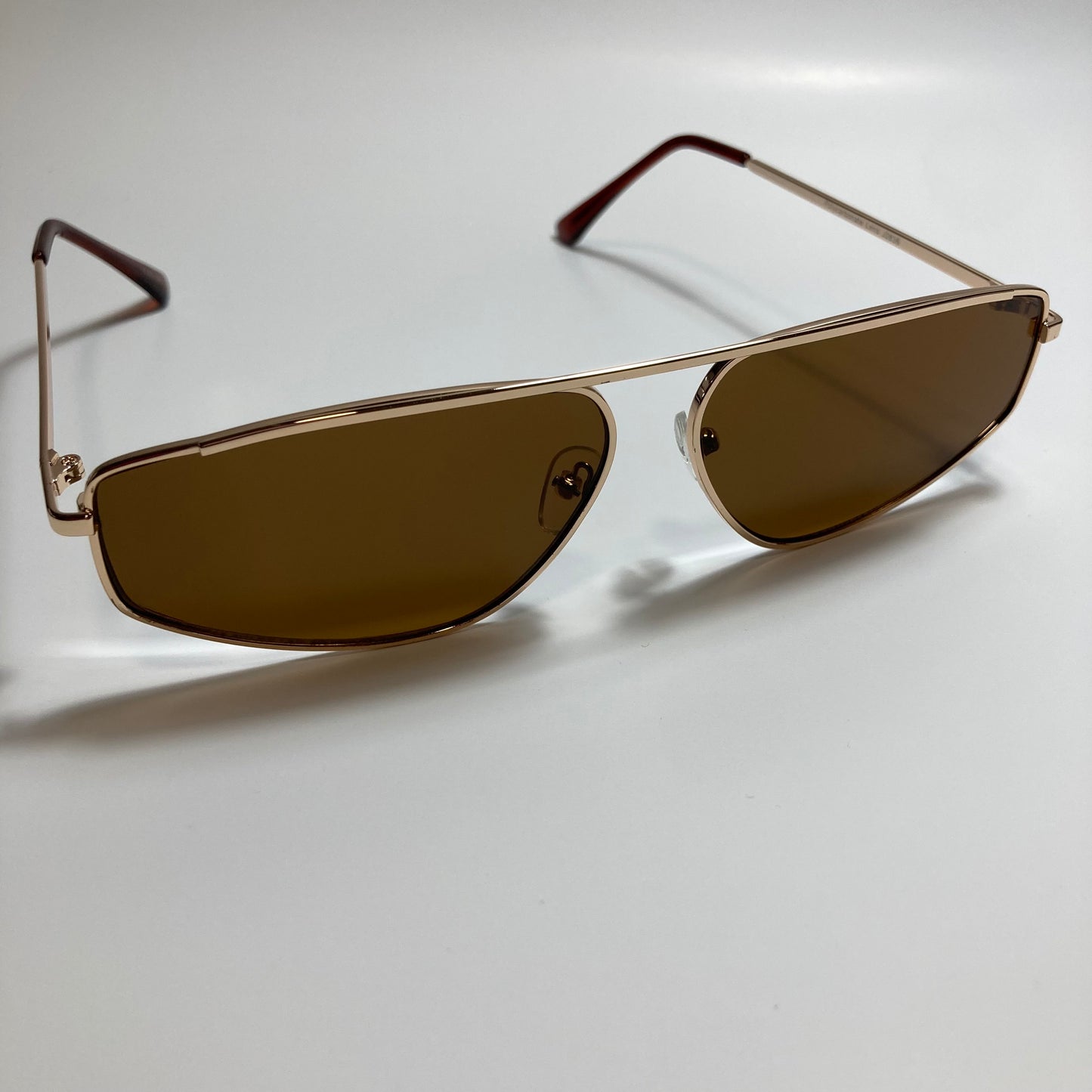 mens and womens brown and gold futuristic sunglasses