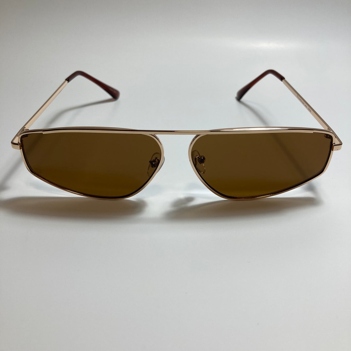 mens and womens brown and gold futuristic sunglasses