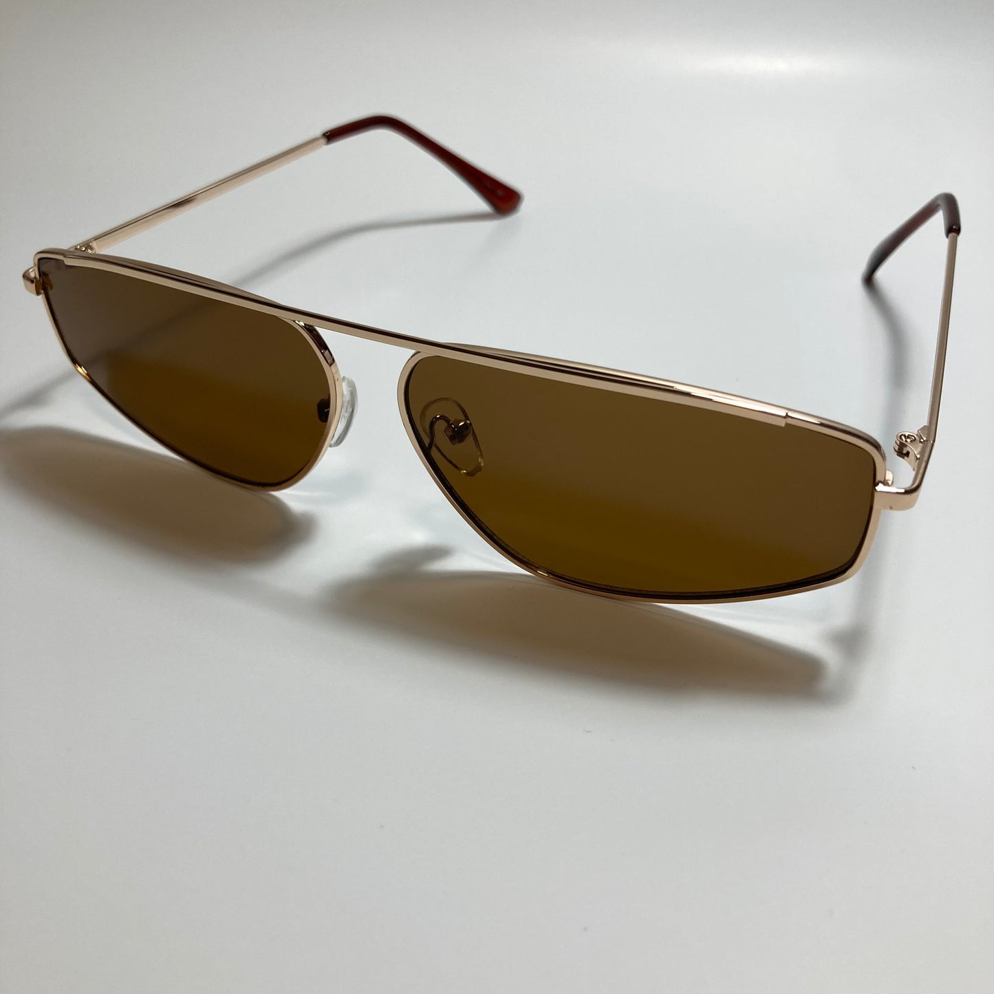 mens and womens brown and gold futuristic sunglasses